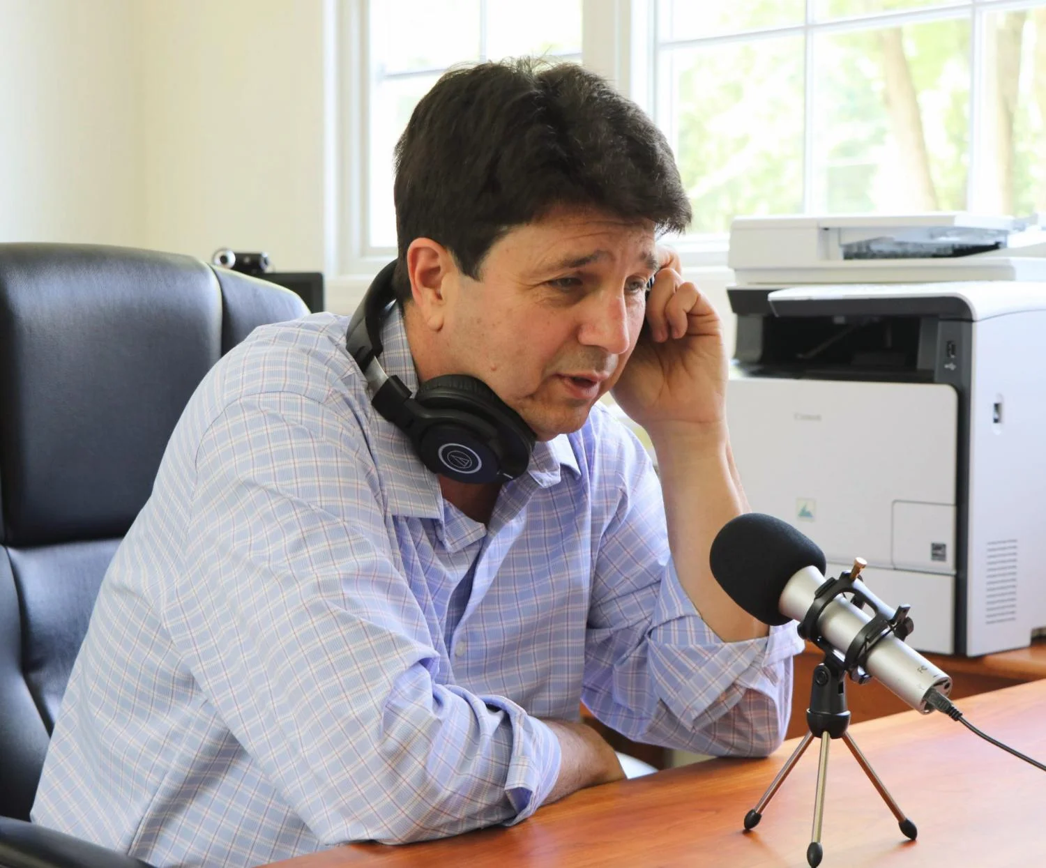 Craig recording his podcast, New Canaan Today