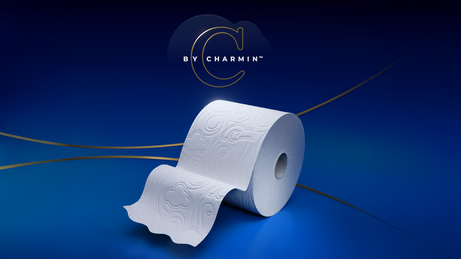A roll of white toilet paper with embossed patterns, partly unrolled, on a dark blue background with the text 'BY CHARMIN' and a stylized 'C' logo above.