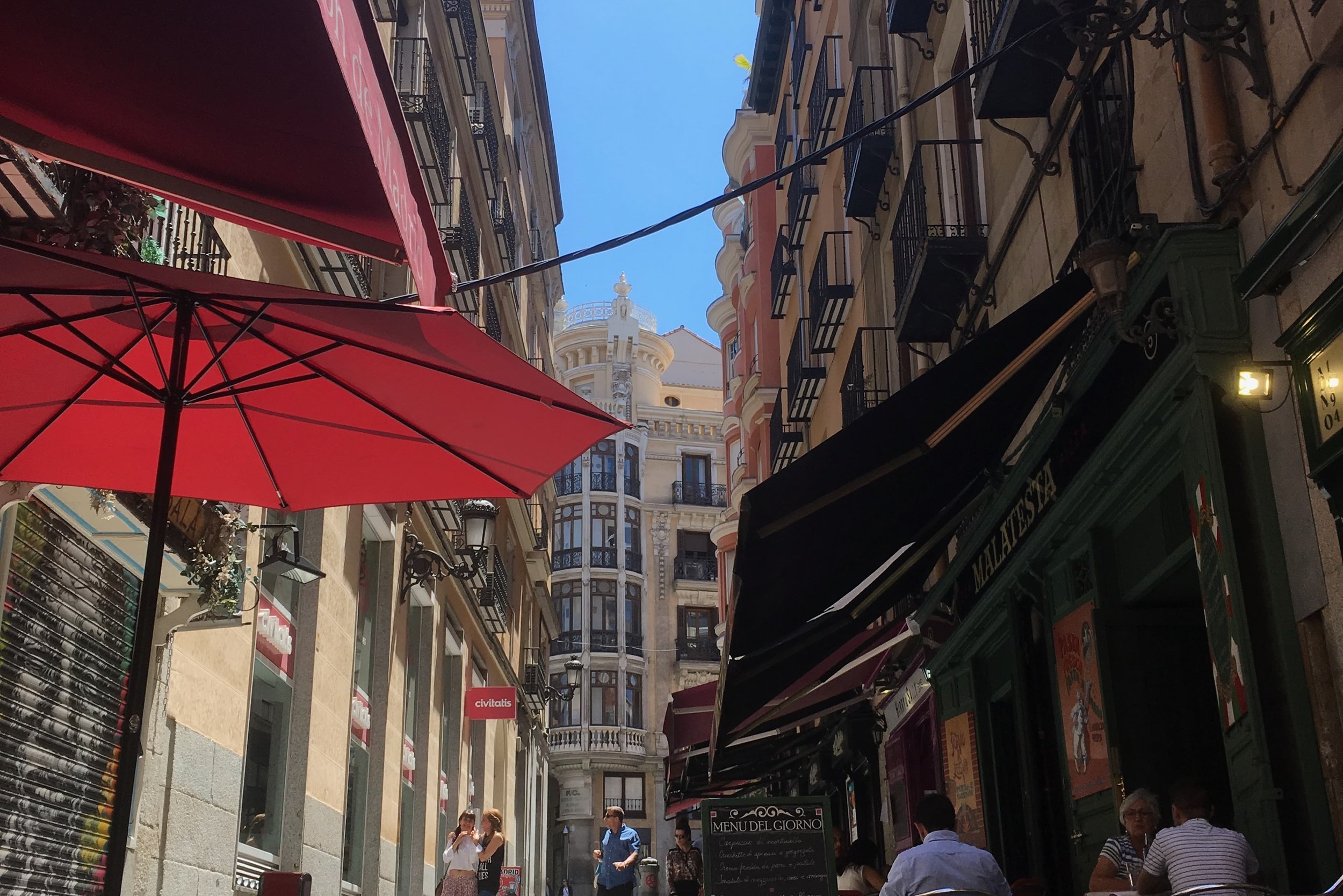 red umbrella and spanish architecture
