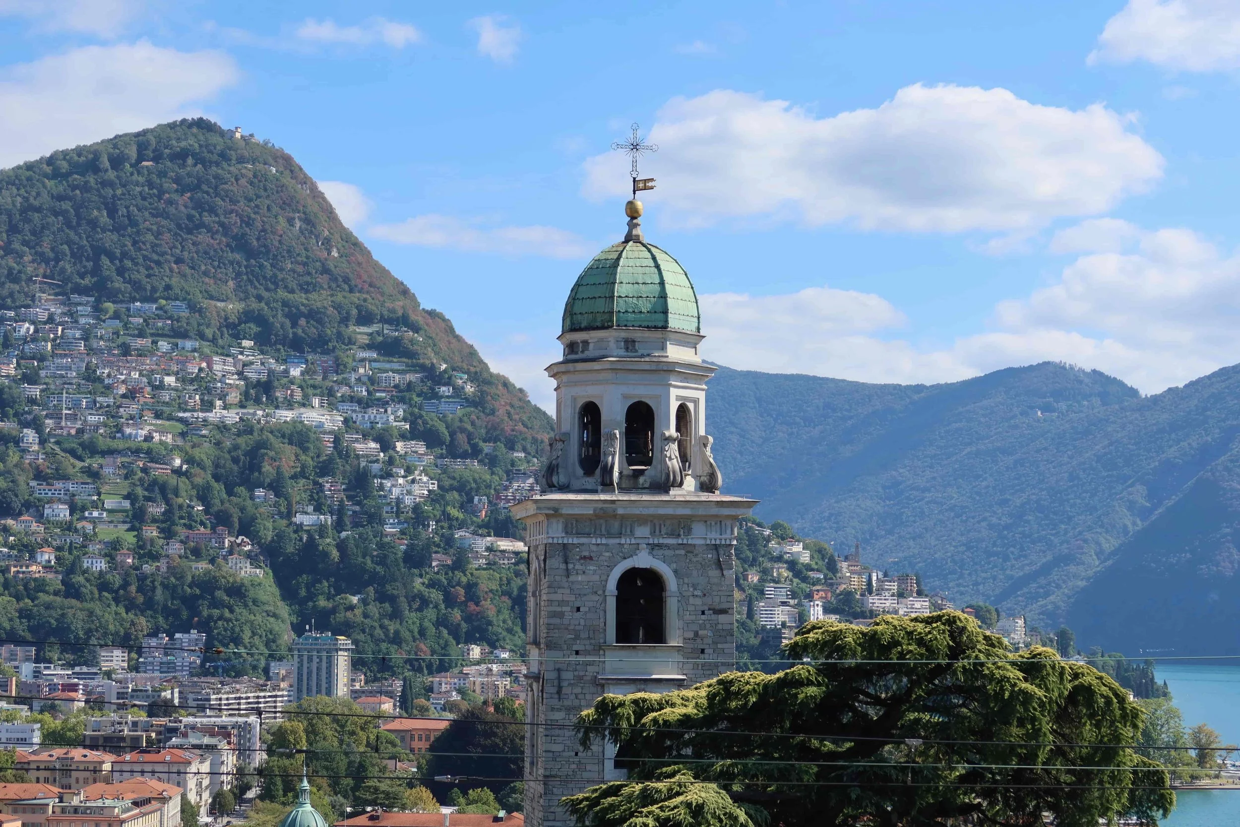 green dome church in lugano surrounded by hills