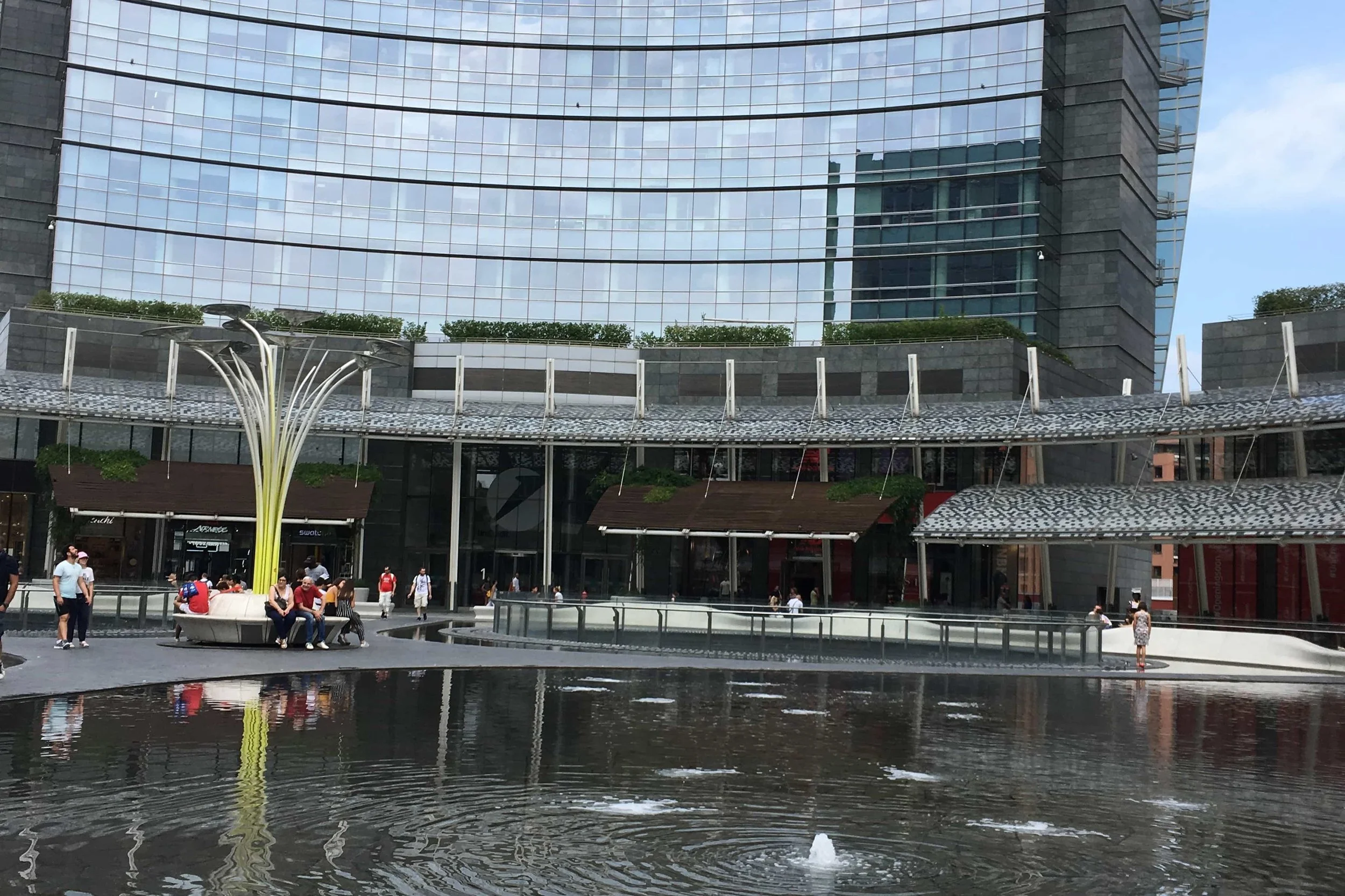 modern buldings and fountain in the middle shopping maill