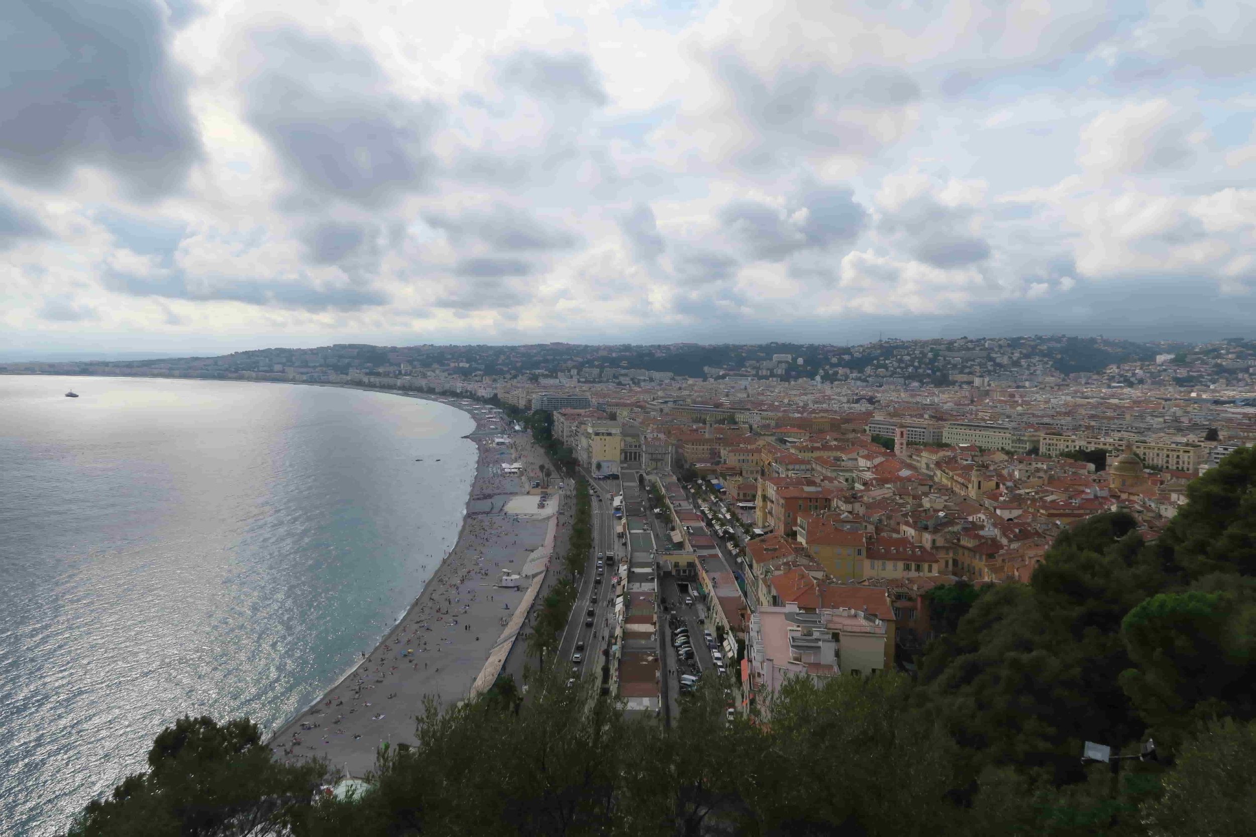 coastline on cloudy day with ocean and orange rooftops