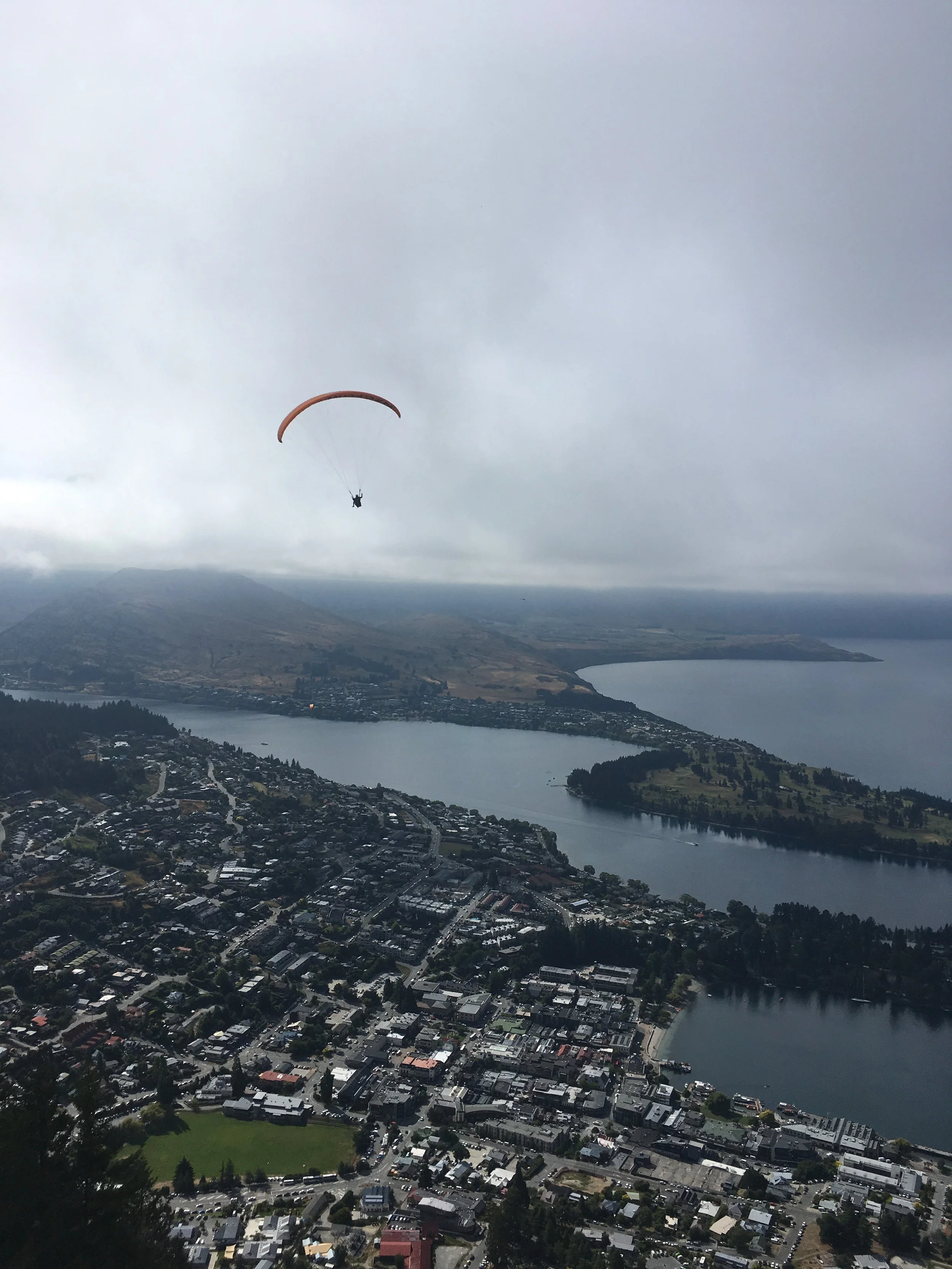 Watching someone paraglide in Queenstown at the top of the Skyline; January 2019