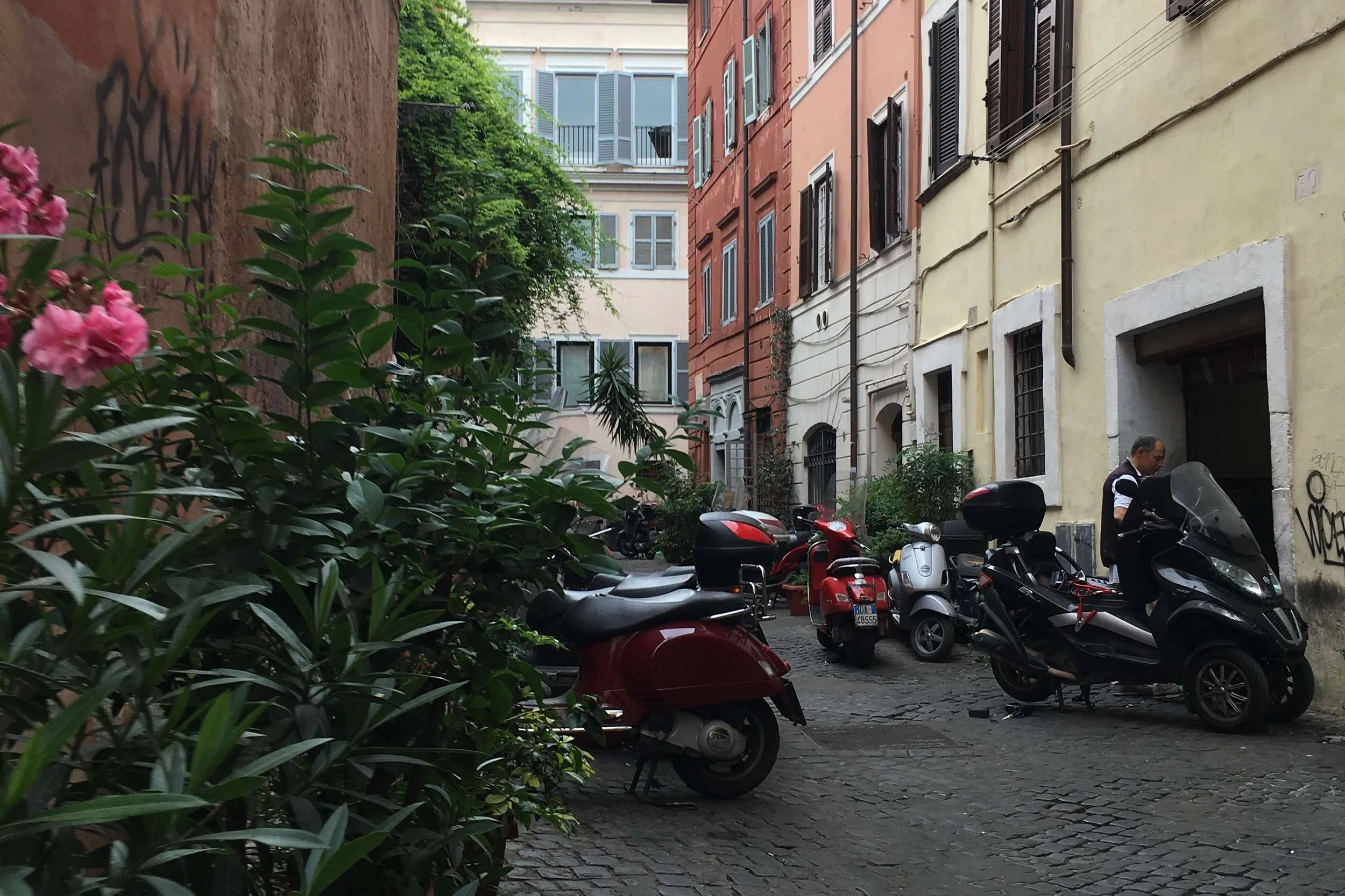quiet street in rome with motorcycles