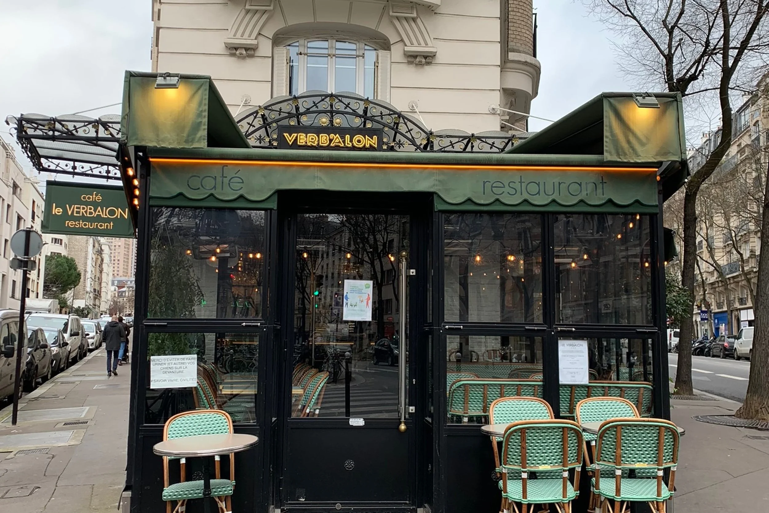 quiet paris cafe with green chairs
