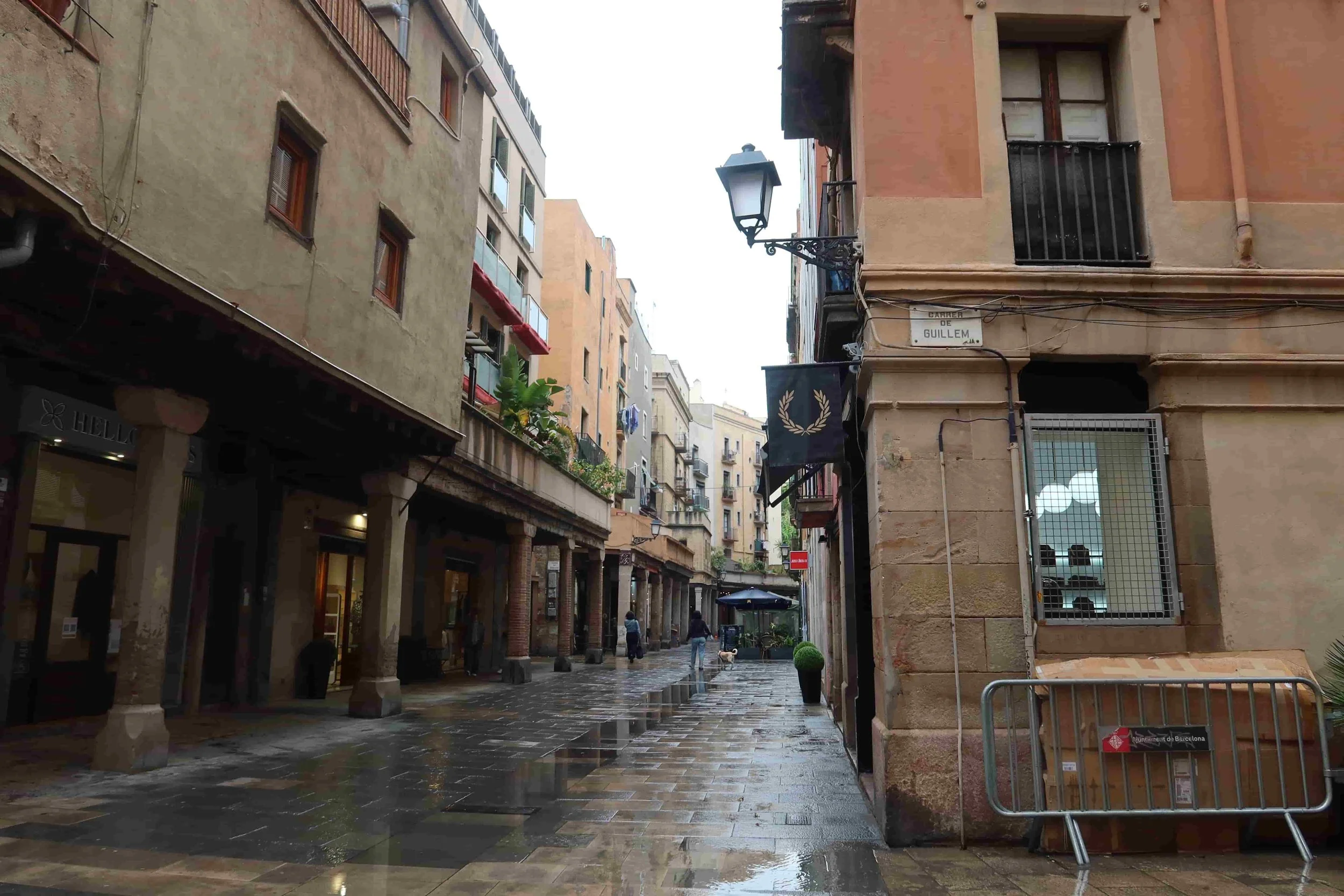 old street in barcelona coblble strone streets wet from rain