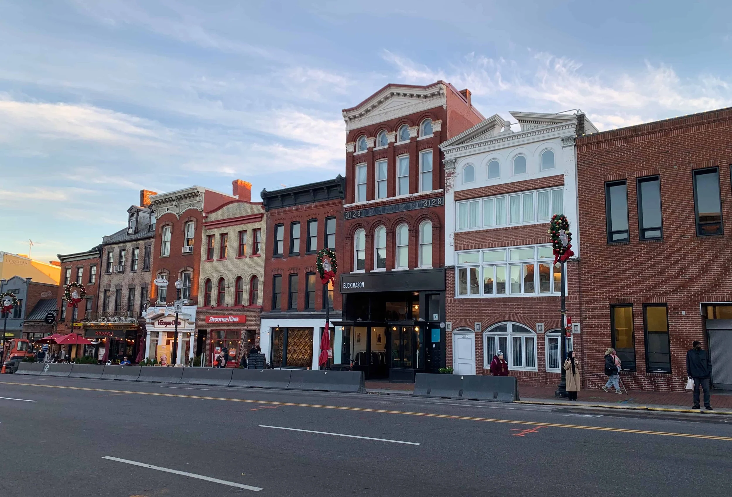 cute buildings on a main street during holiday season
