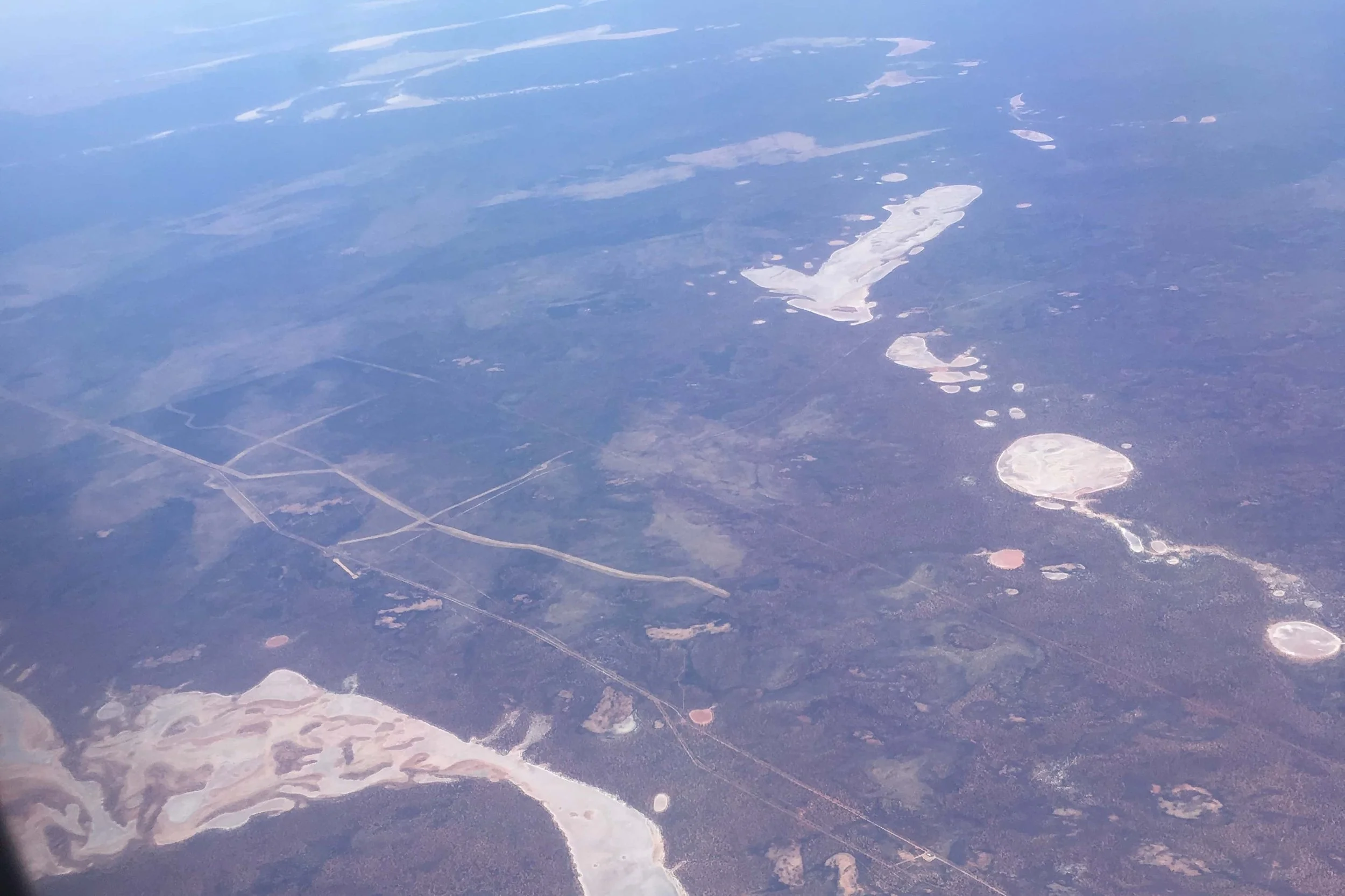 flying over barren land in perth