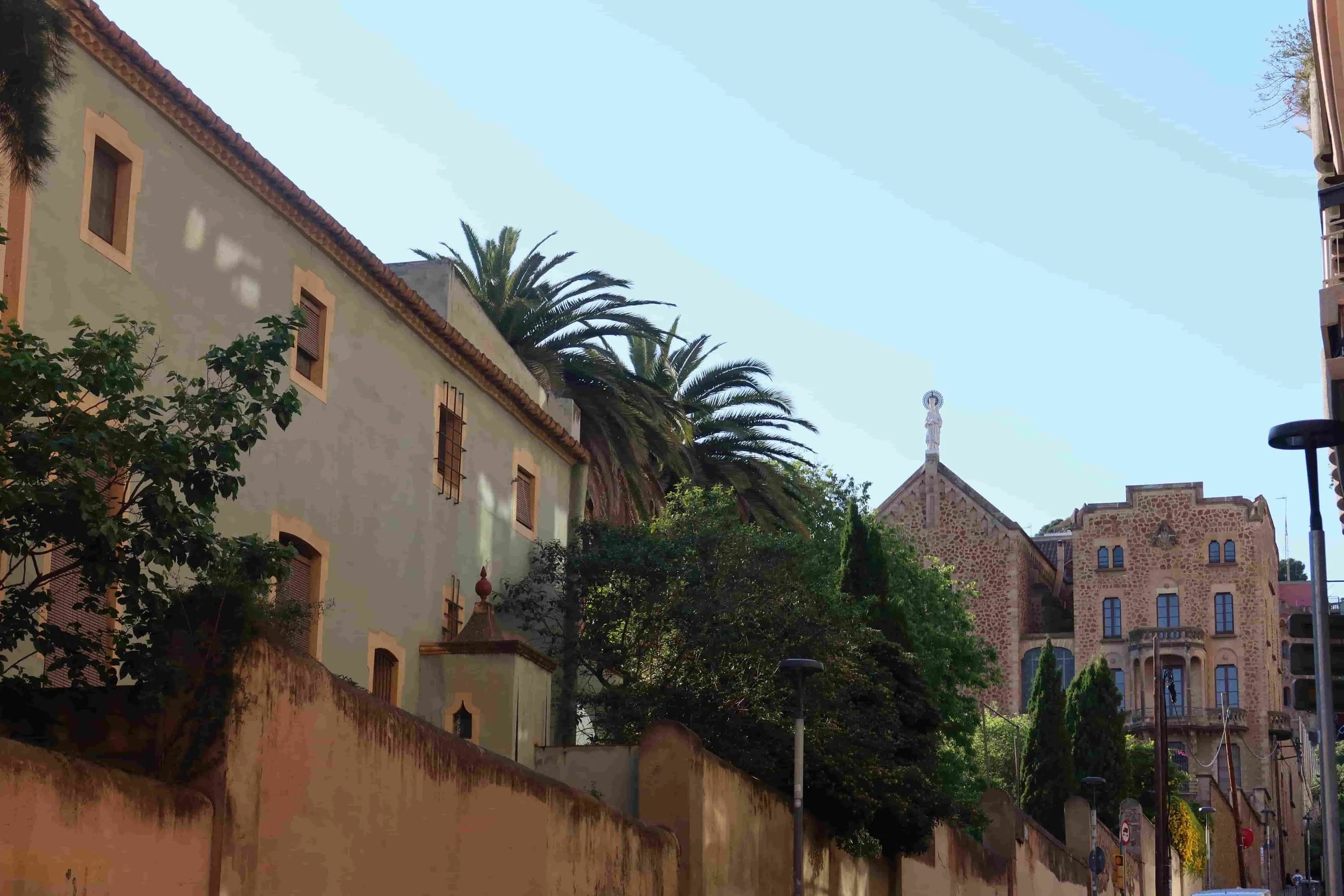residential street in barcelona orange and teal buildings with shade
