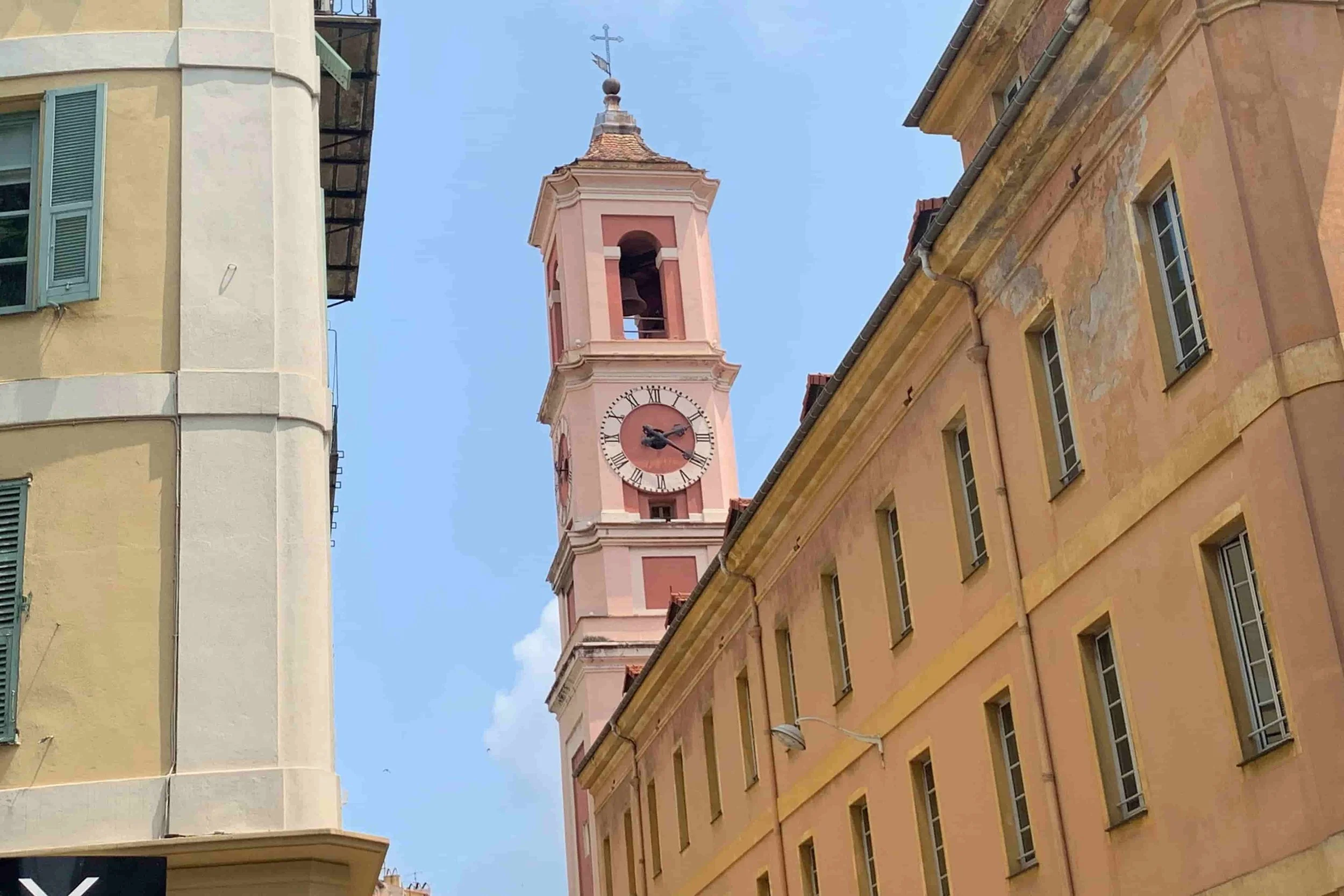 pink clock tower in nice