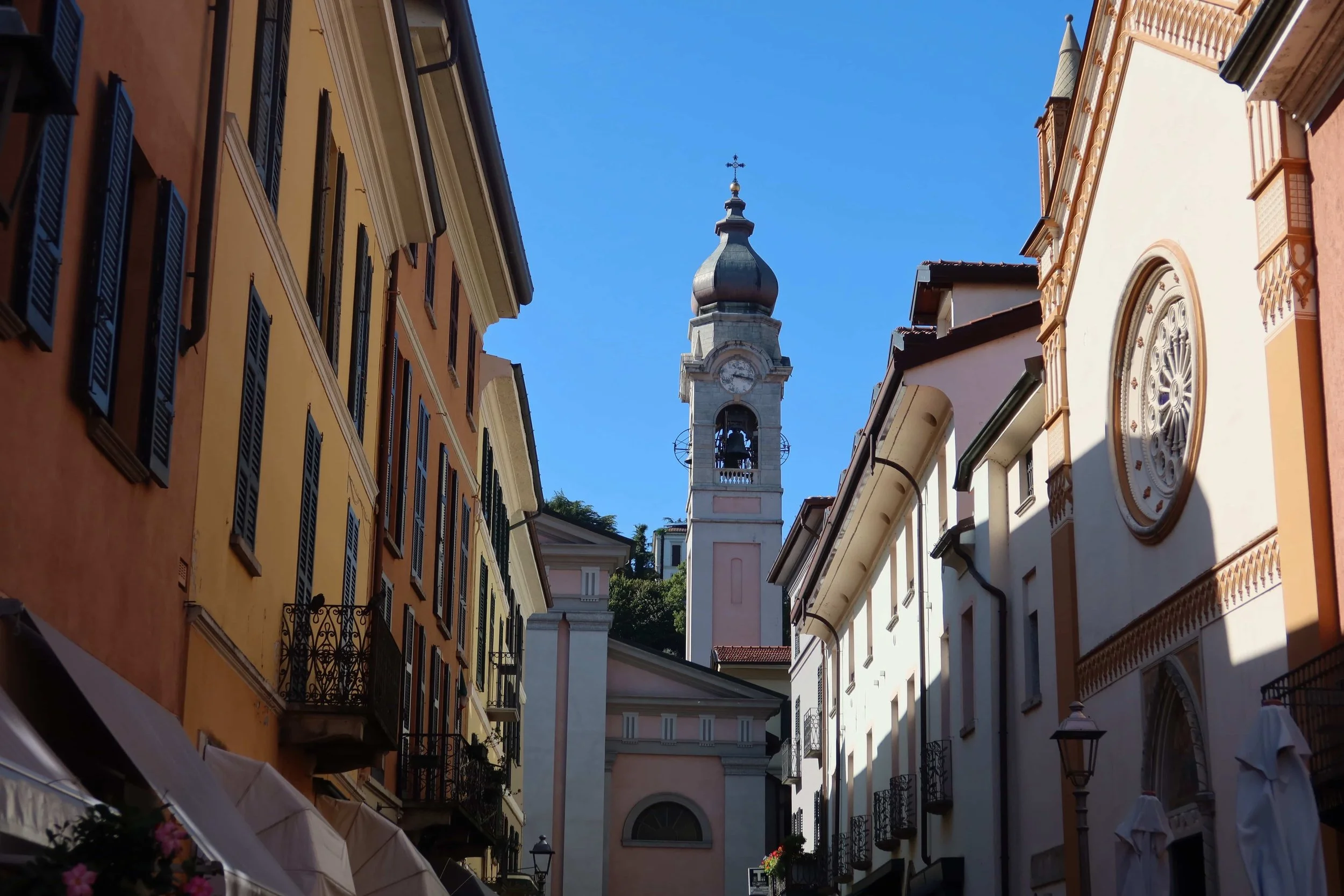 charming street with church orange yellow and pale colors