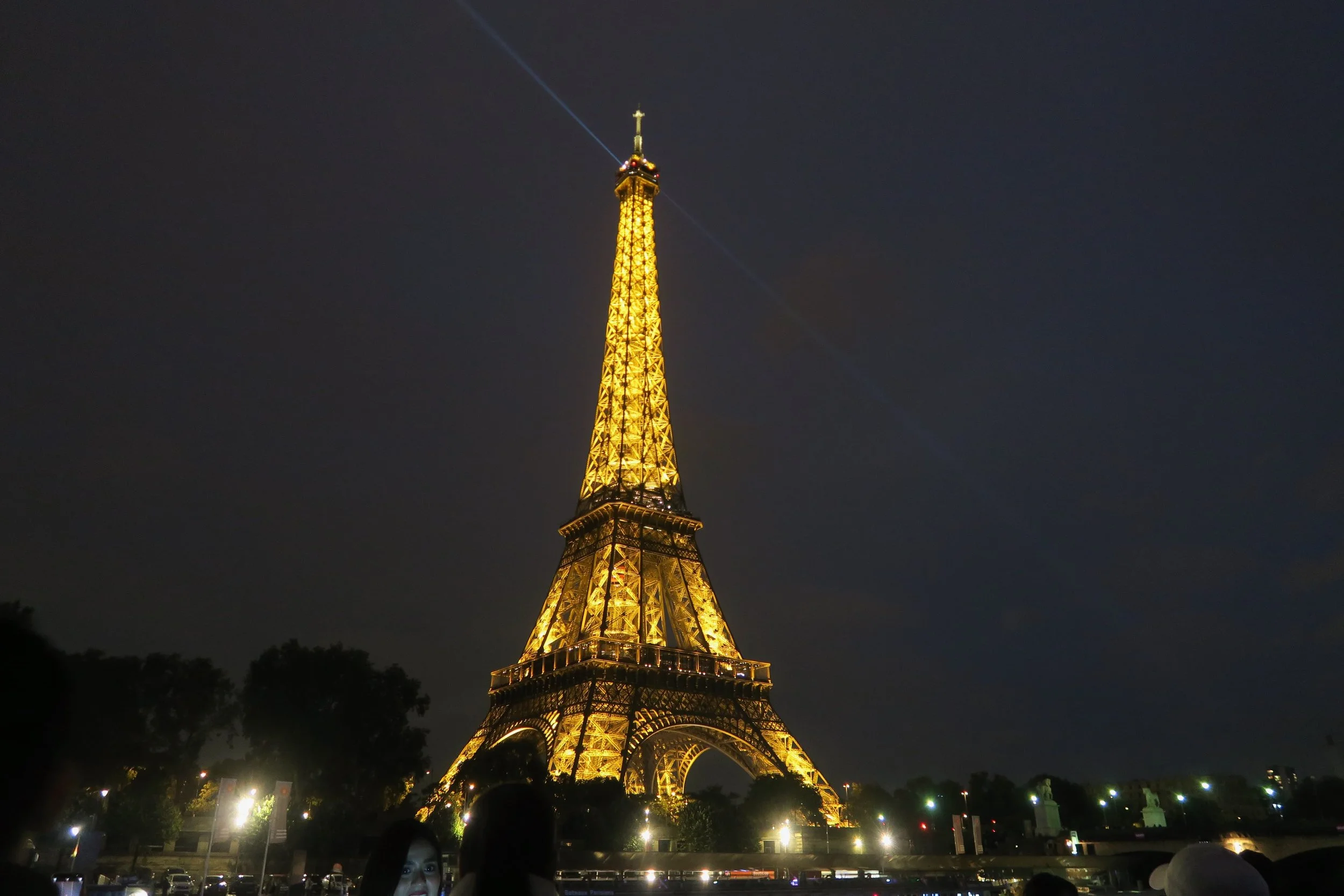 View of Eiffel Tower at night on bateaux mouches; September 2025