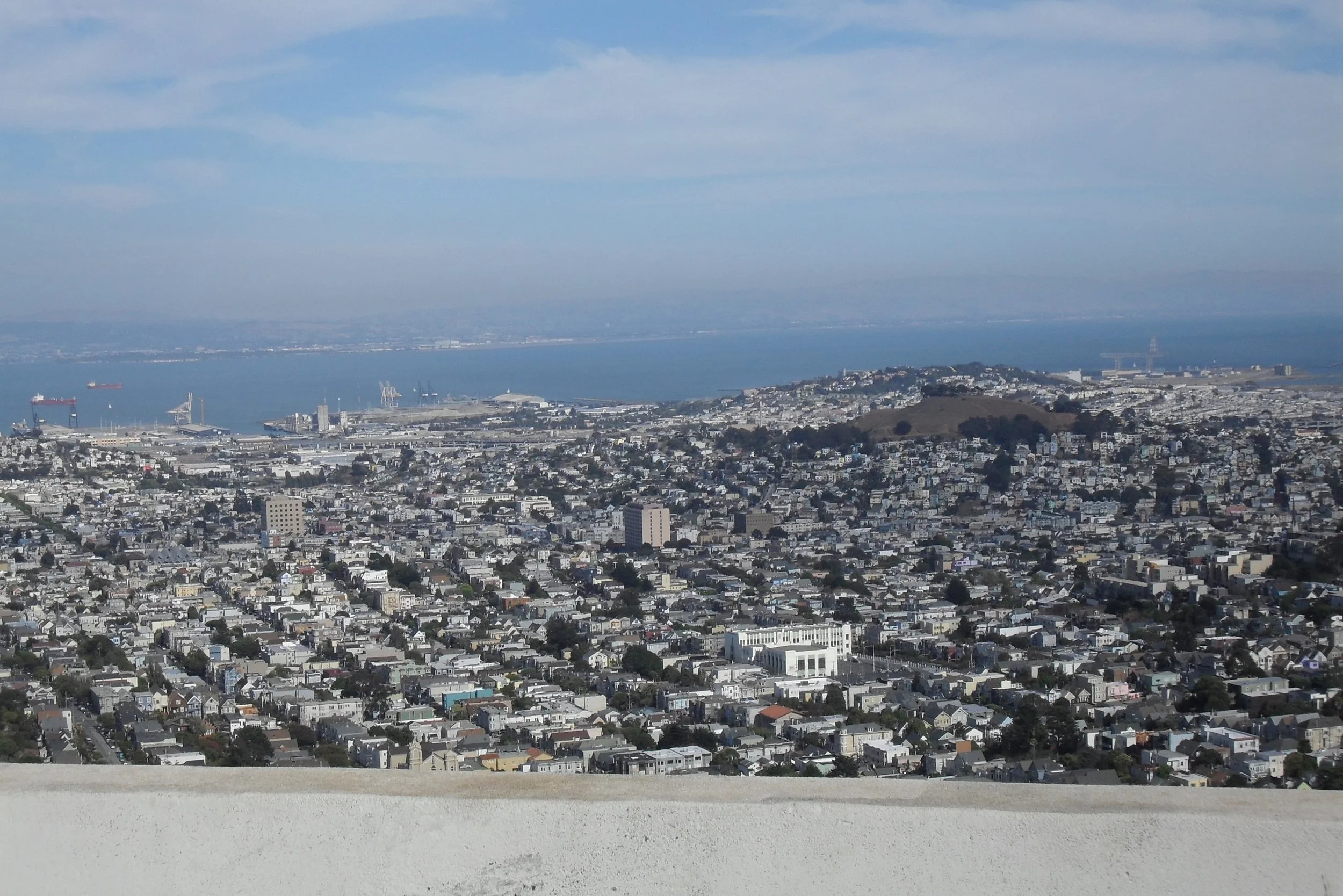 view of san francisco white buildings and ocean in distance