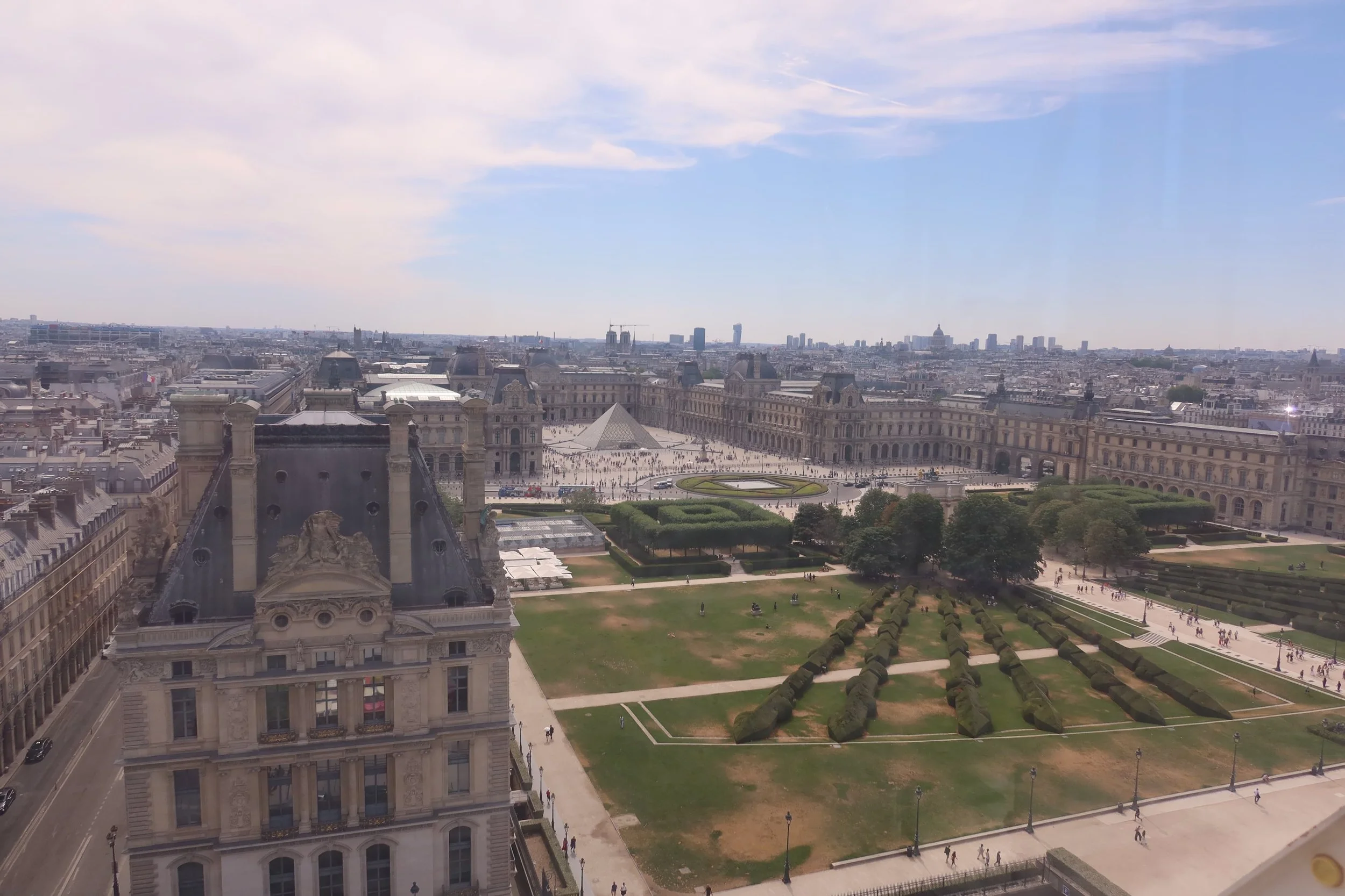 view of lovure and jardin des tulieries from above sunny day