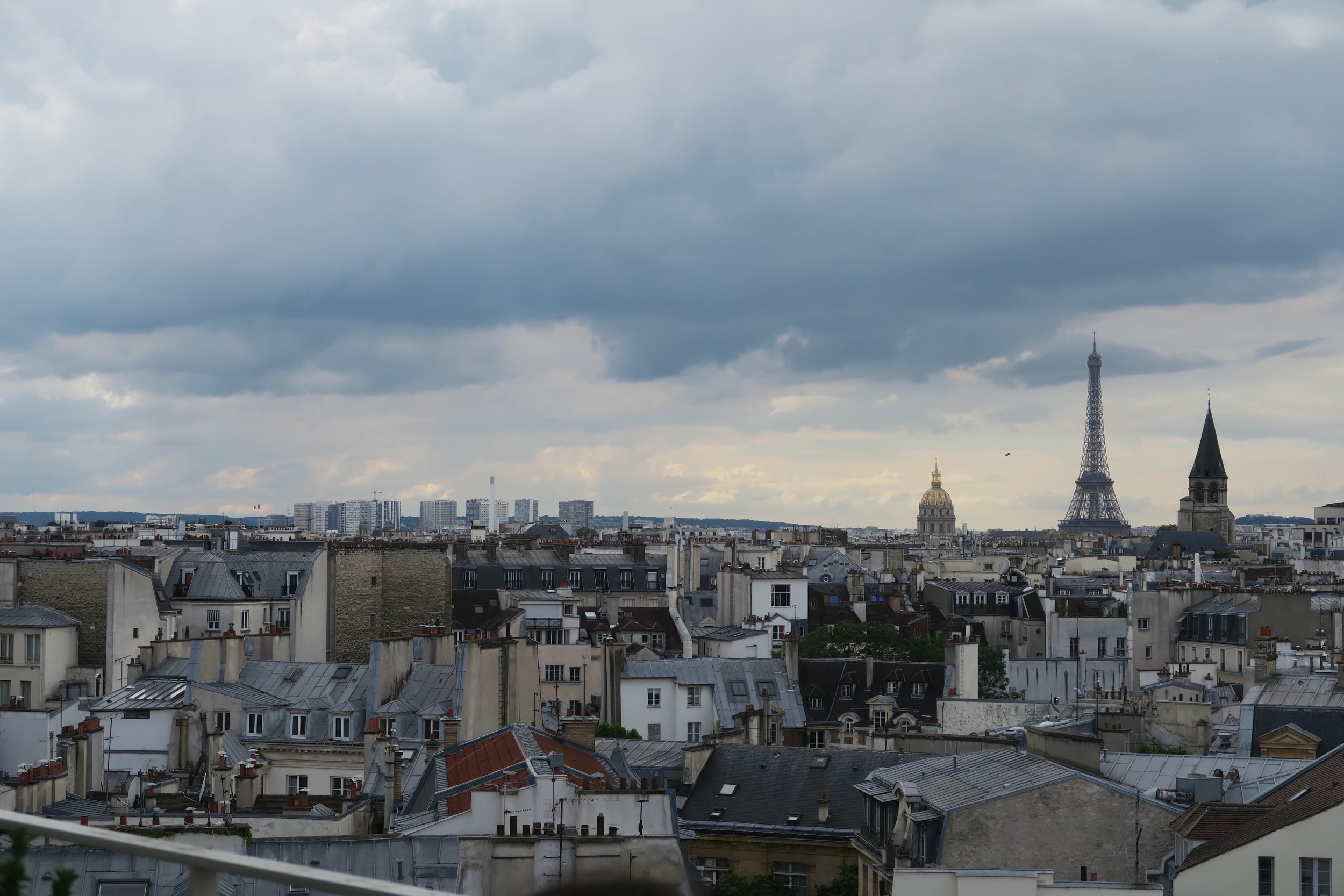 View of Eiffel Tower and the rest of Paris from rooftop bar