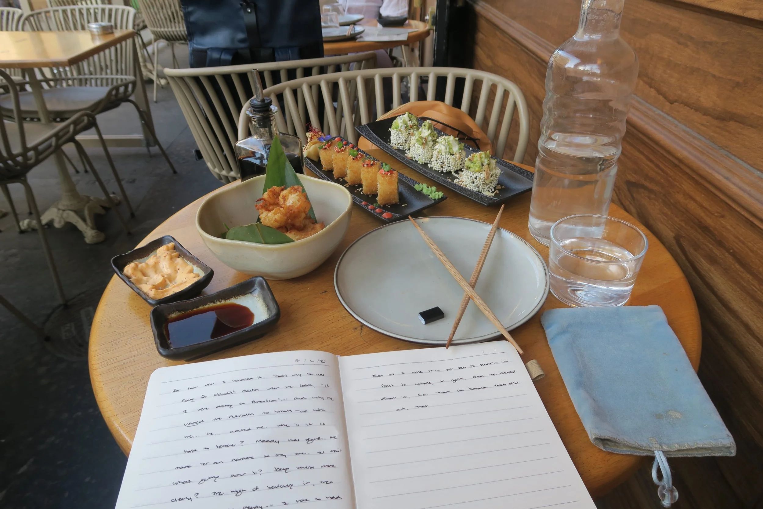 sushi cauliflower tempura and journal on the table