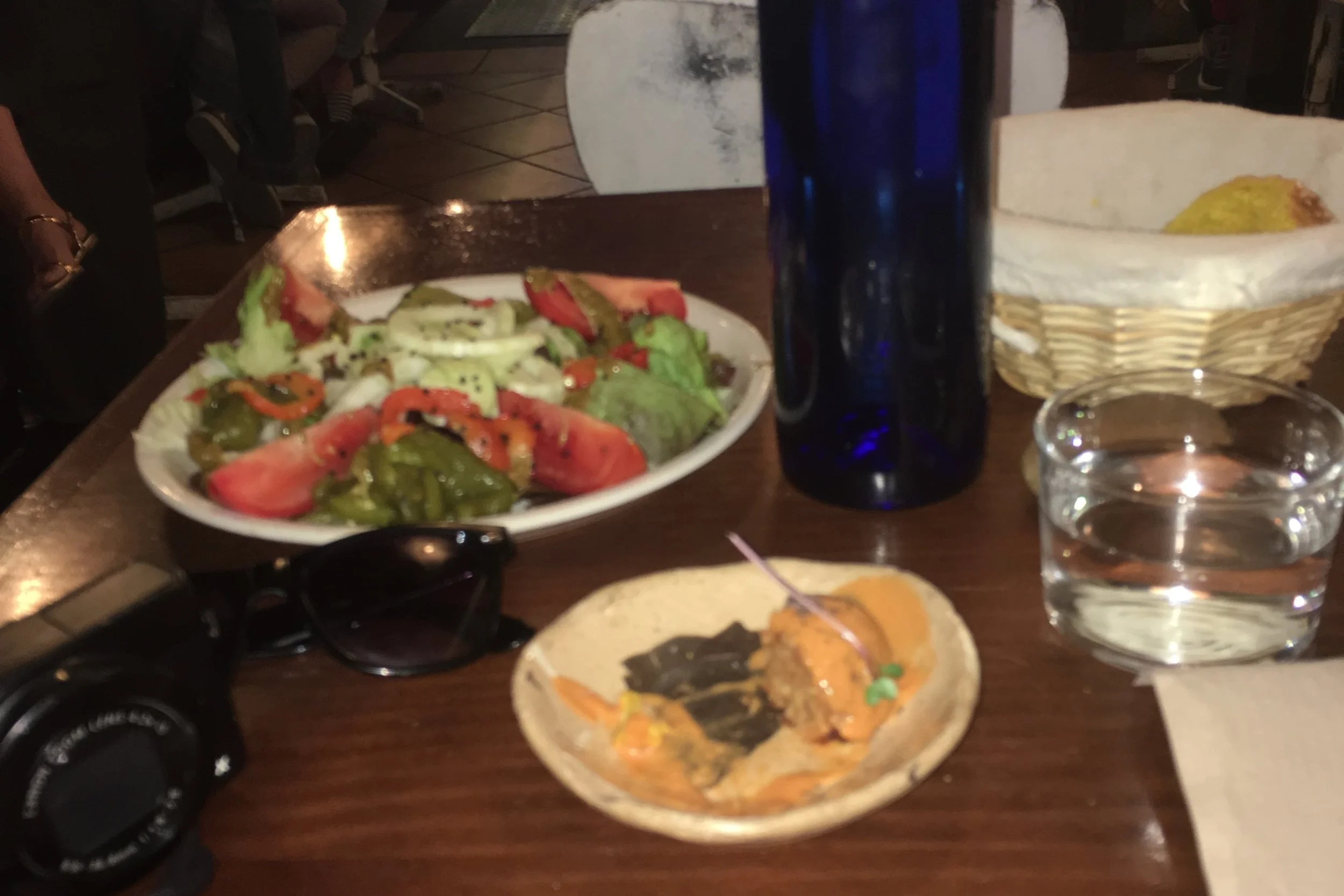 tomato fennel salad and rice ball on brown table