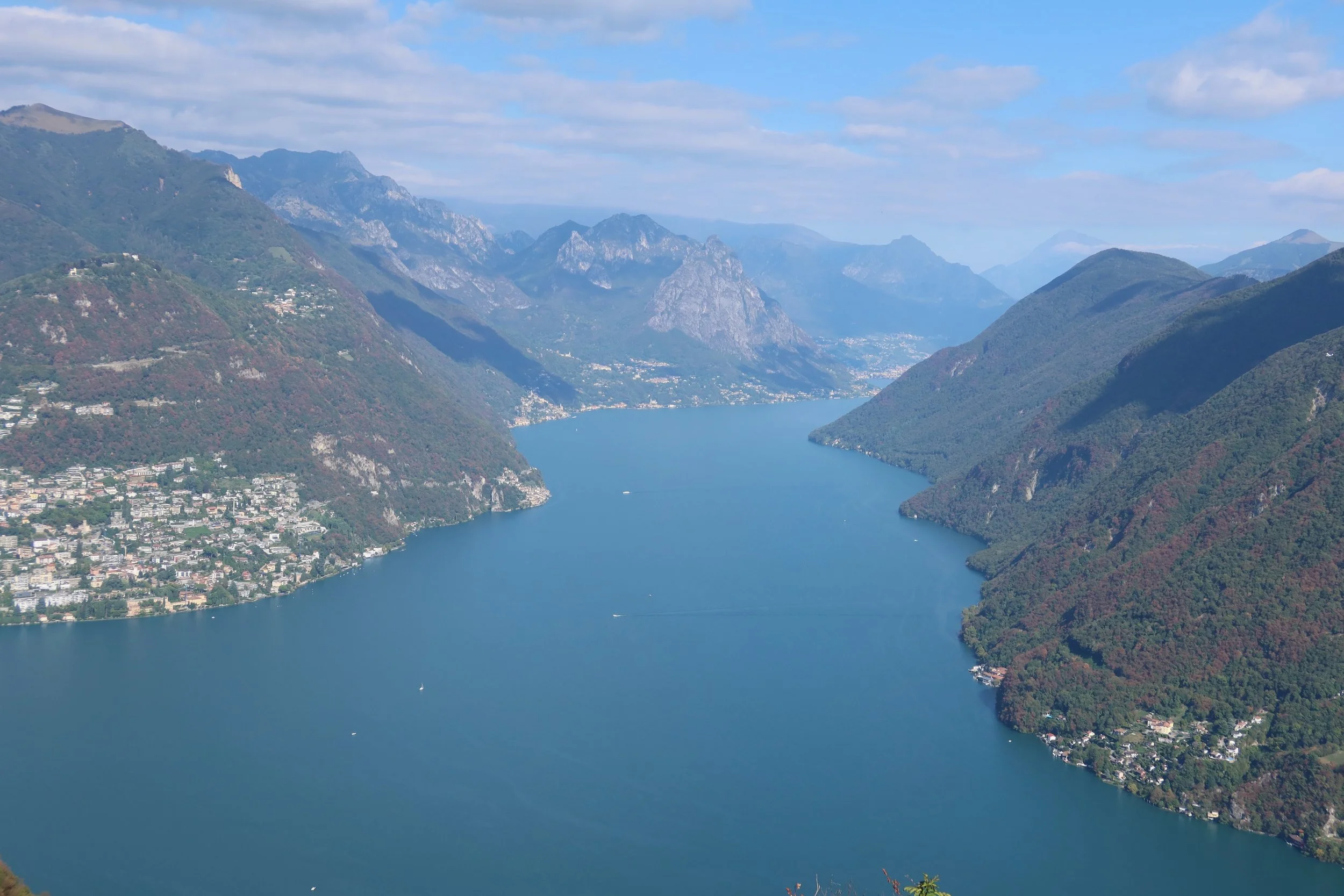 dramatic views of teal water and mountains lake lugano
