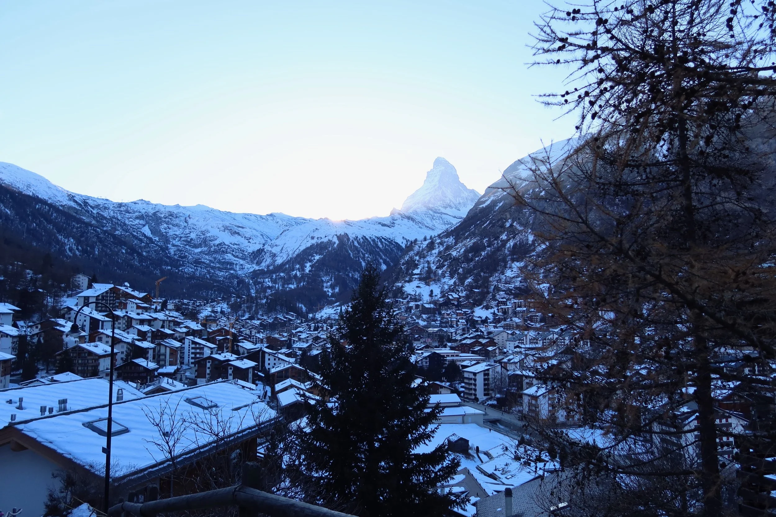 View of the Matterhorn and snow-capped chalets and homes in Zermatt
