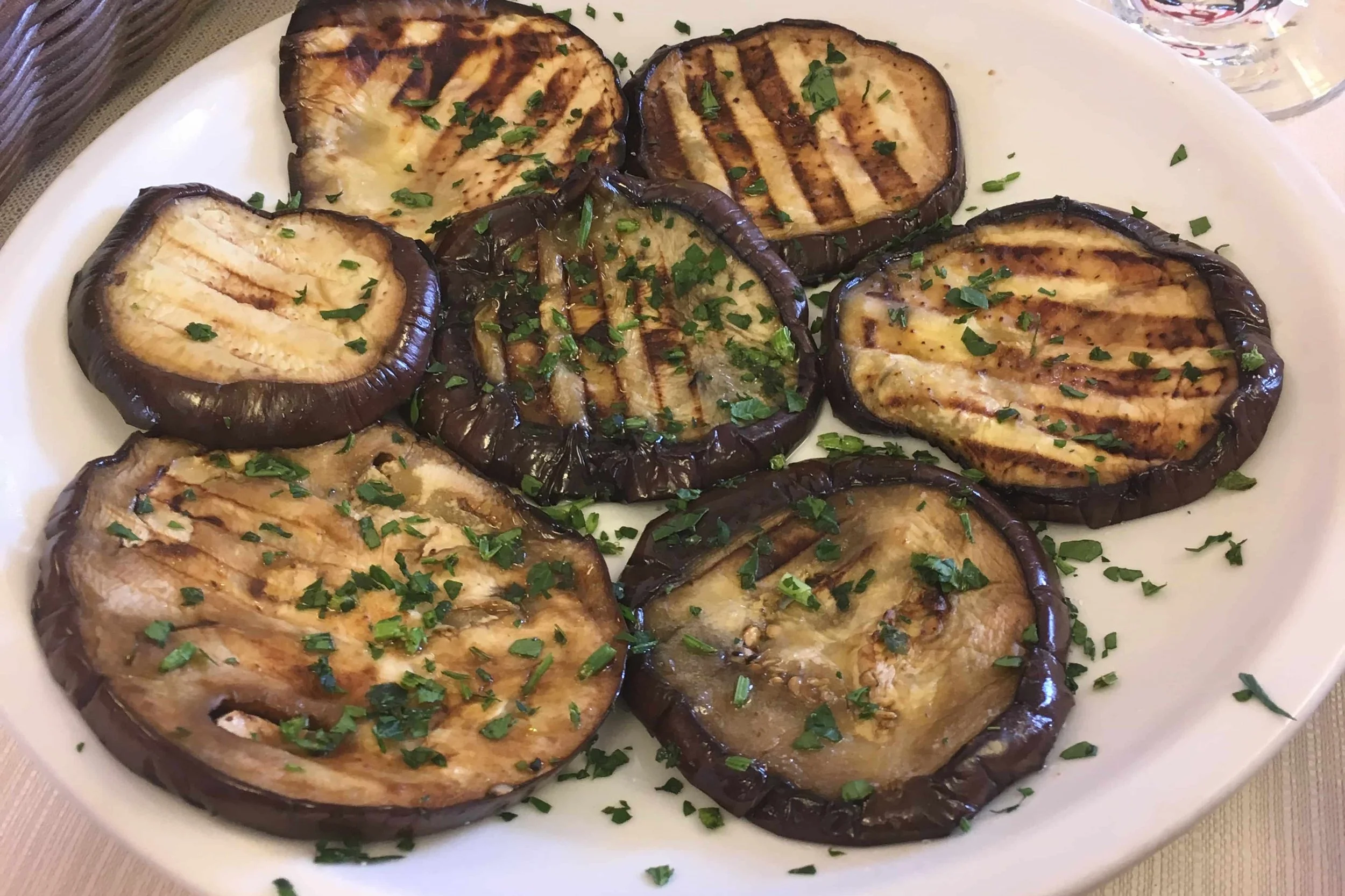 grilled eggplant on white plate