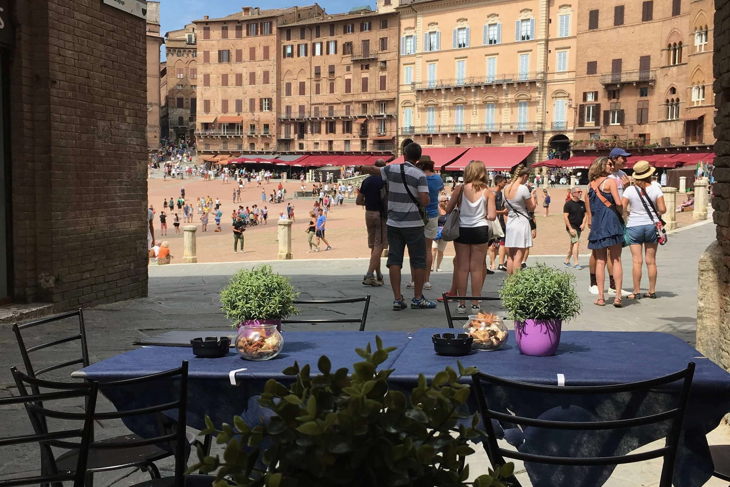 blue table with view of busy plaza
