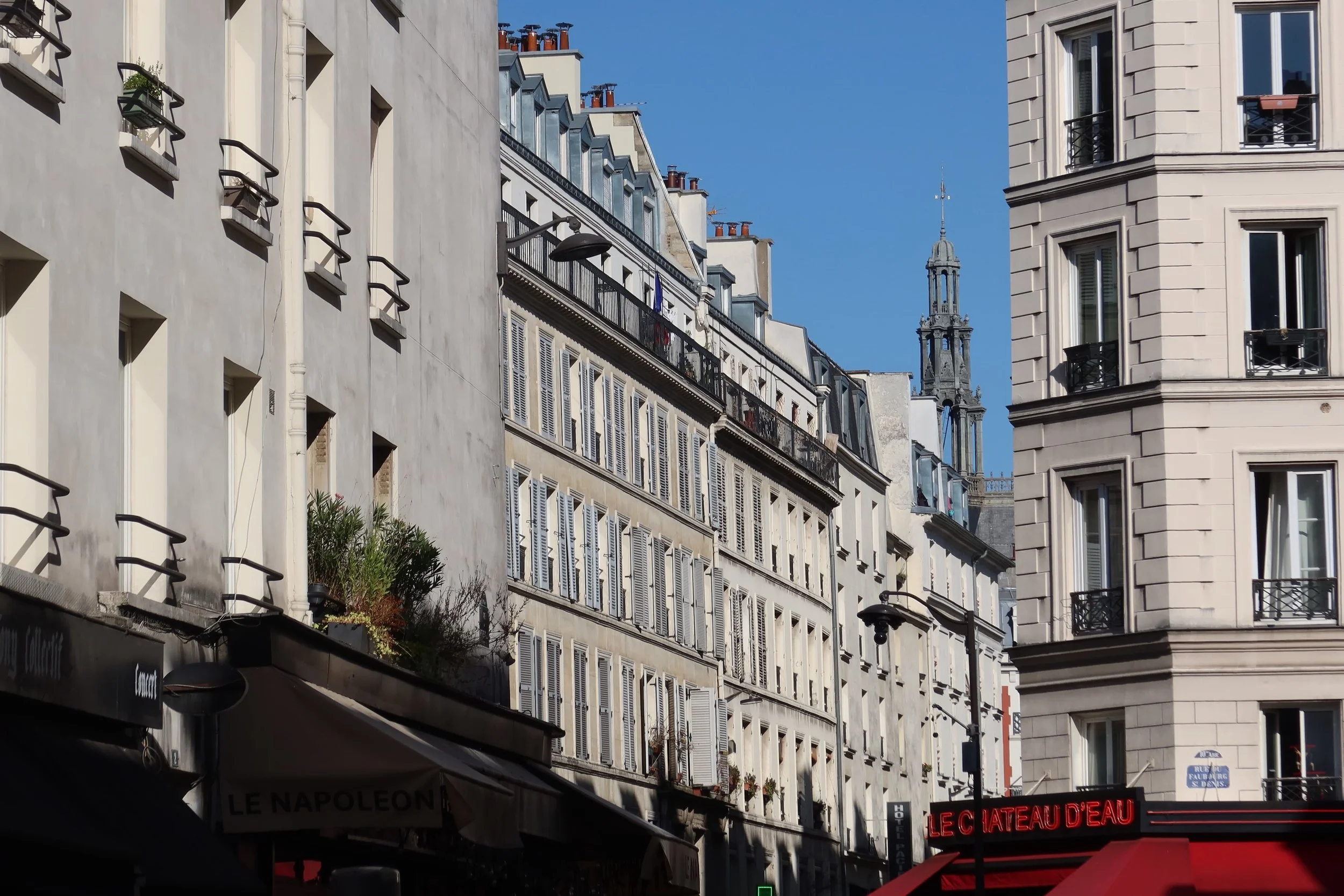 church peaking out of corner in paris streets