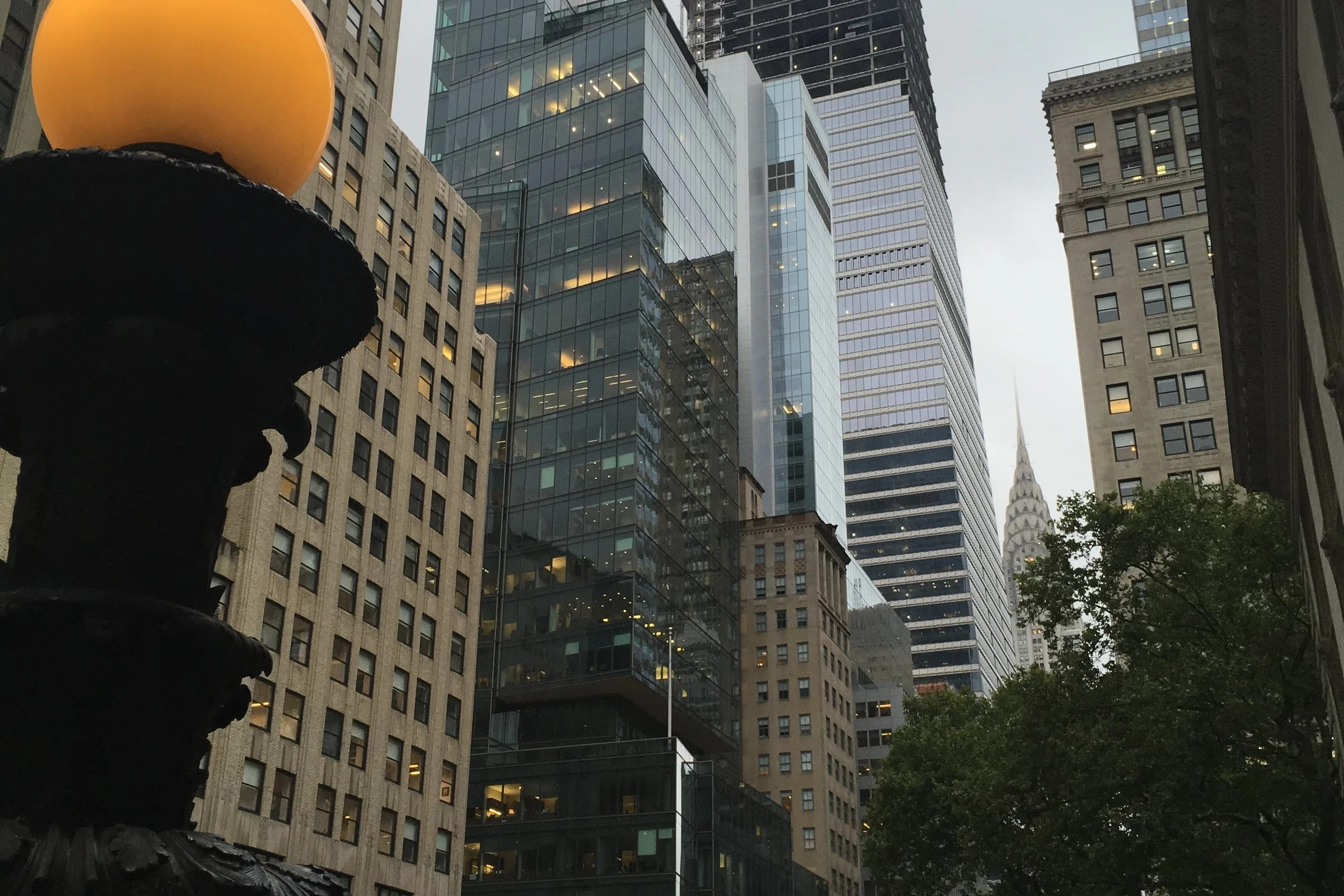 midtown nyc buildings trees and chyrsler building