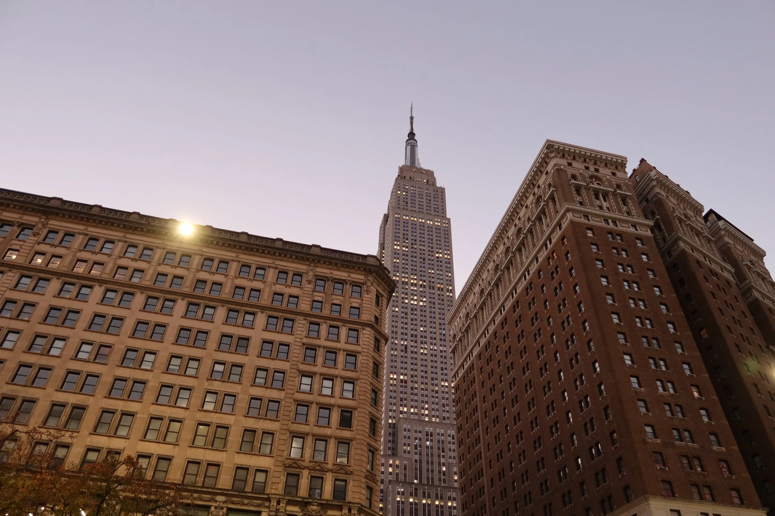 View of Empire State Building in New York City at sunset