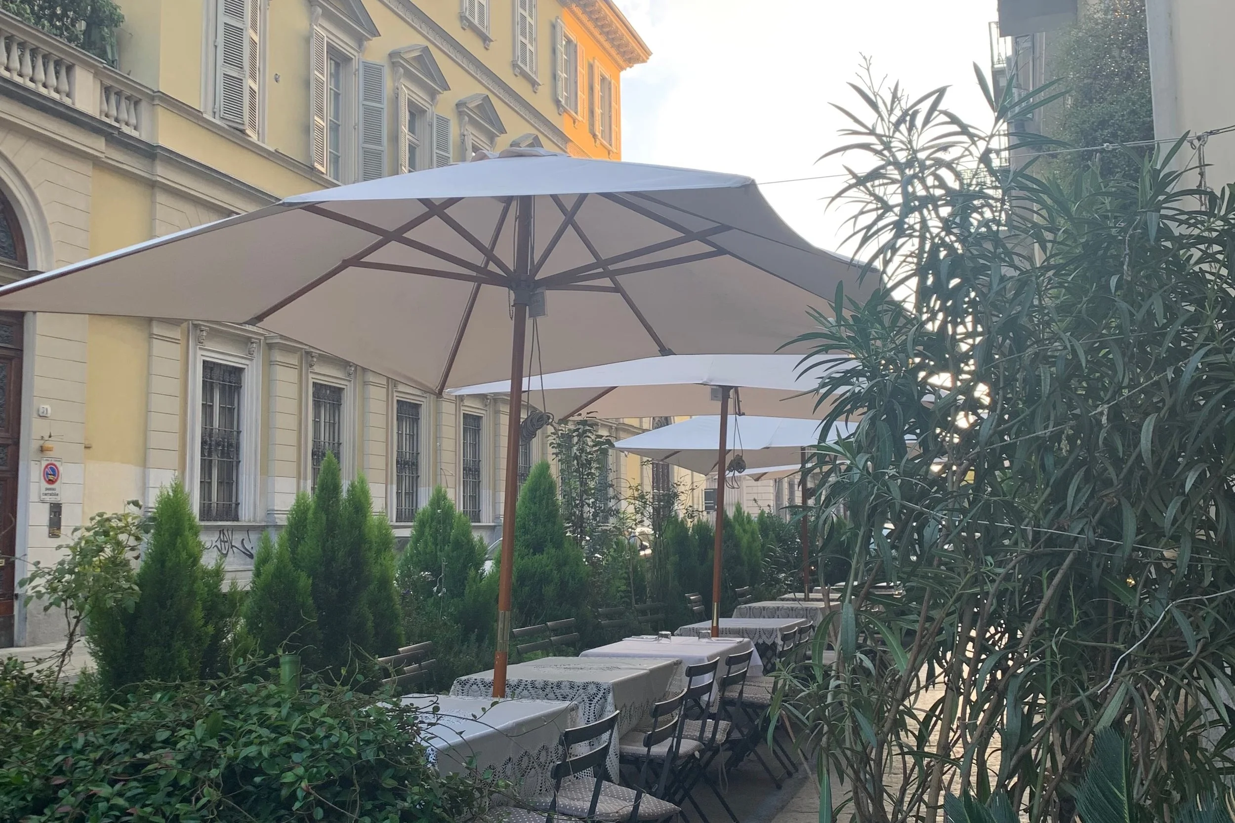 cafe street in turin yellow building