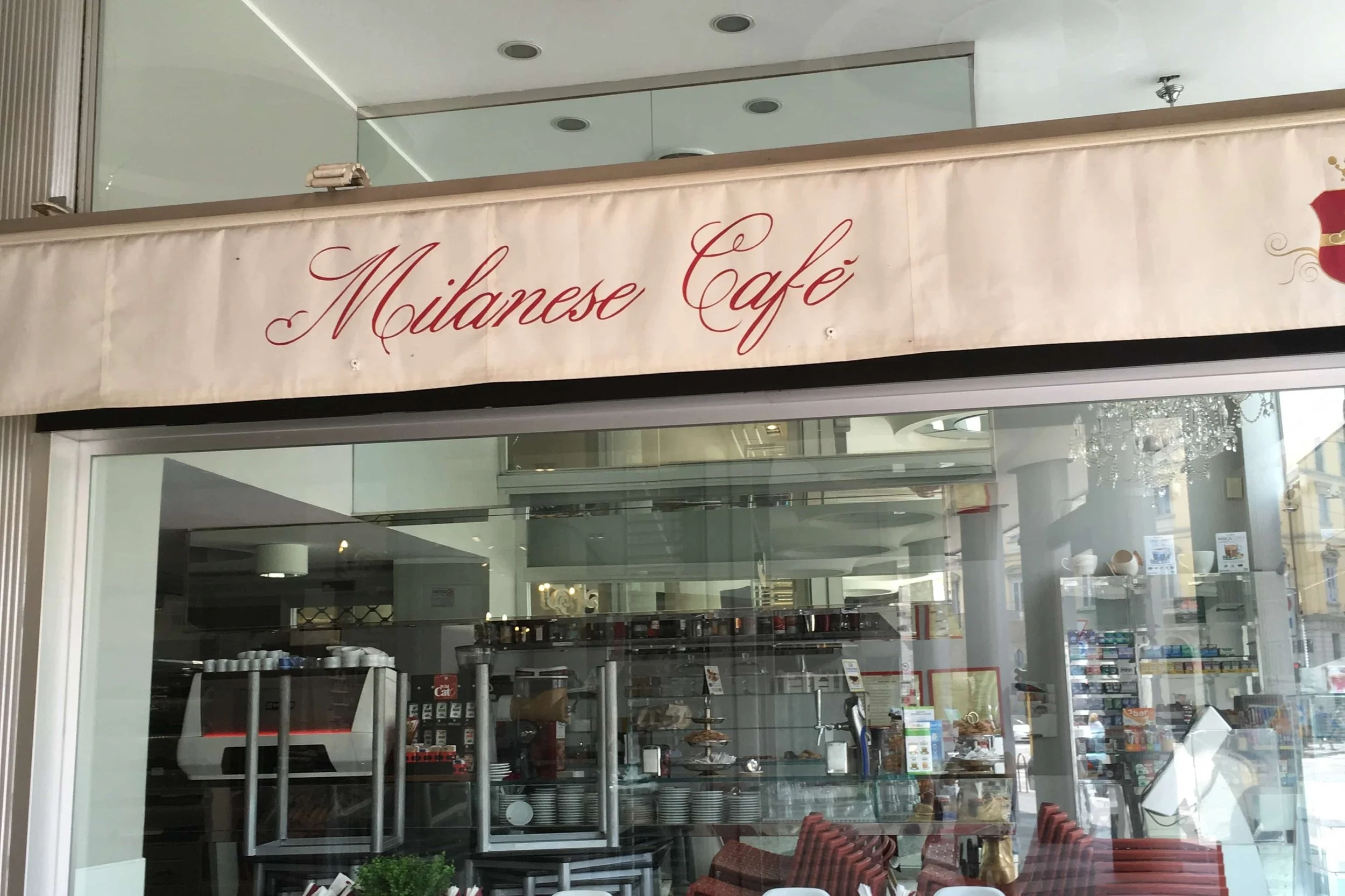 milaense cafe tan and red sign