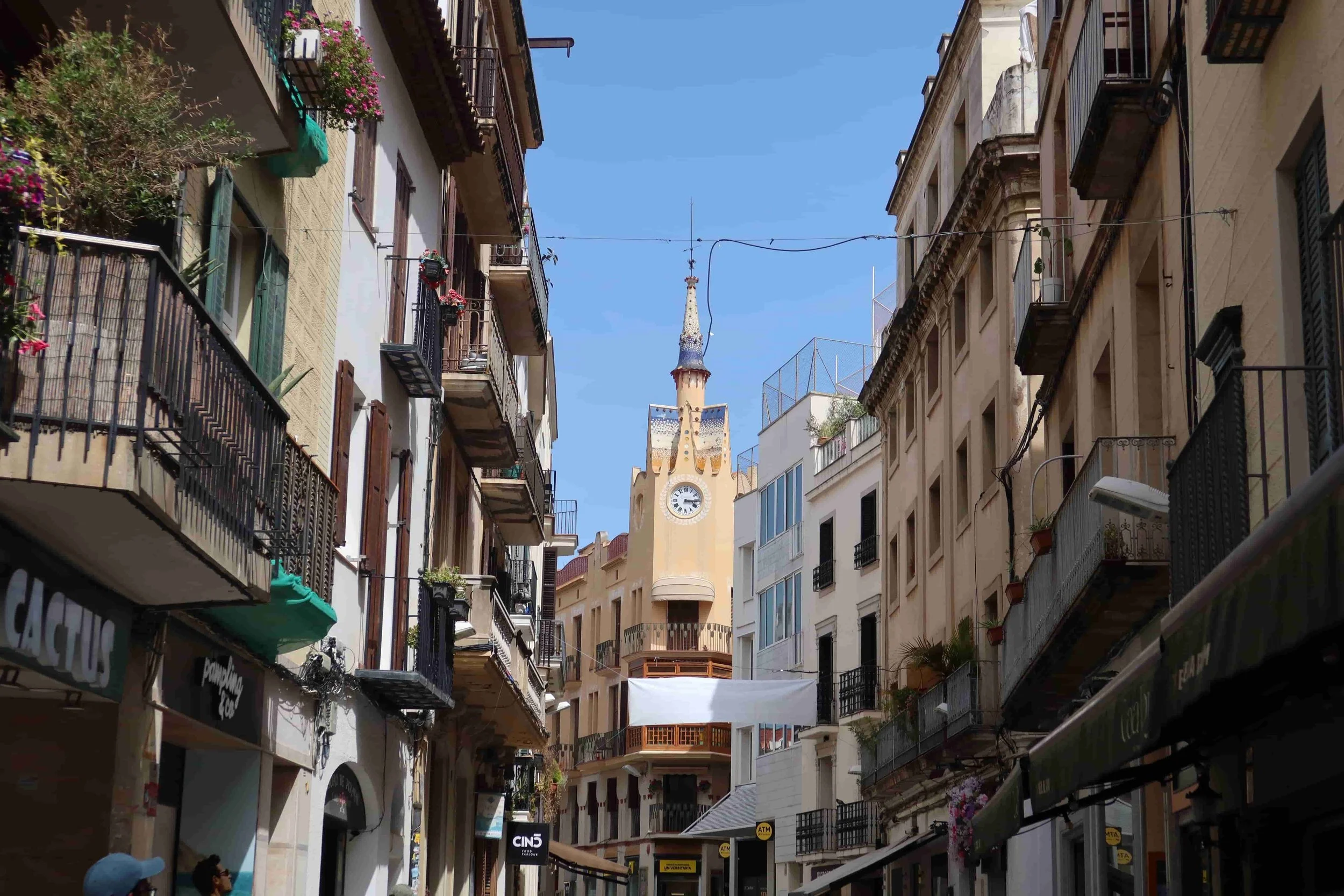 yellow clock tower in old beach town