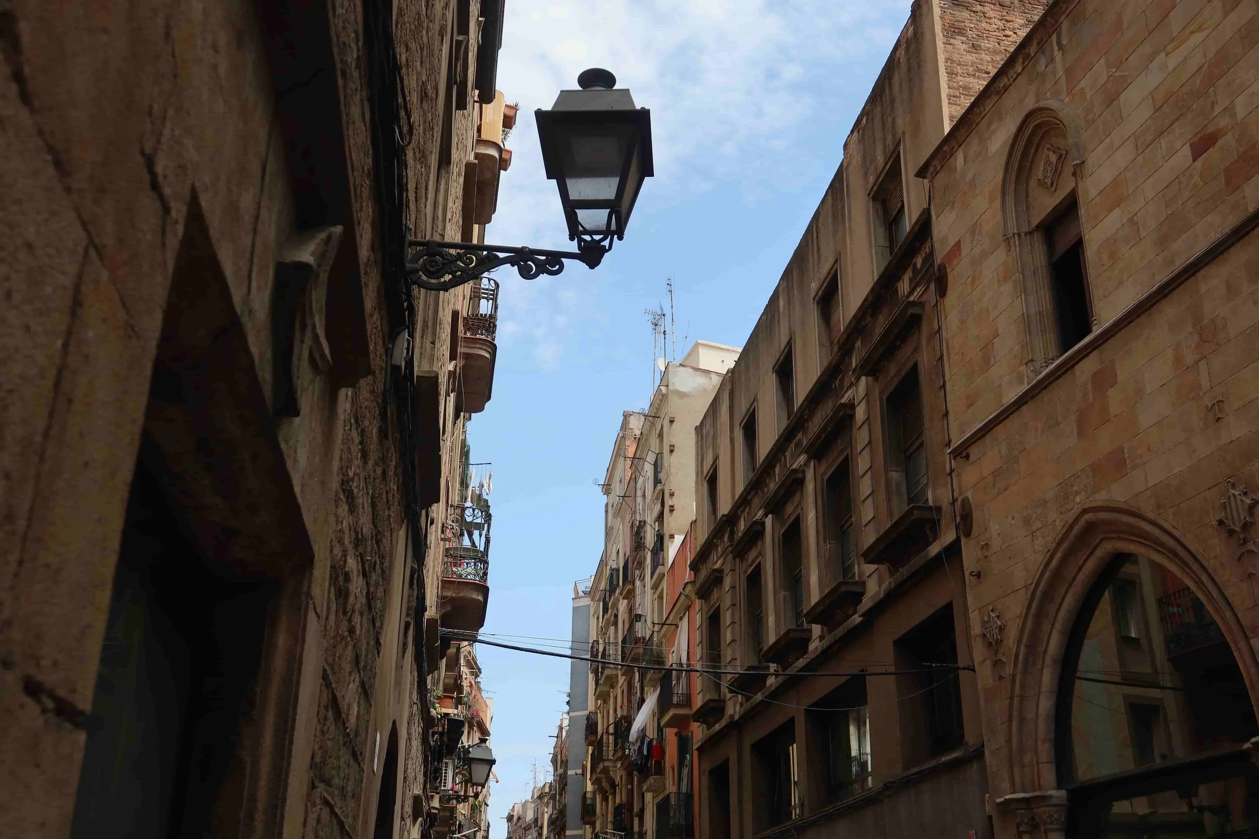 lamp post and narrow streets in gothic quarter