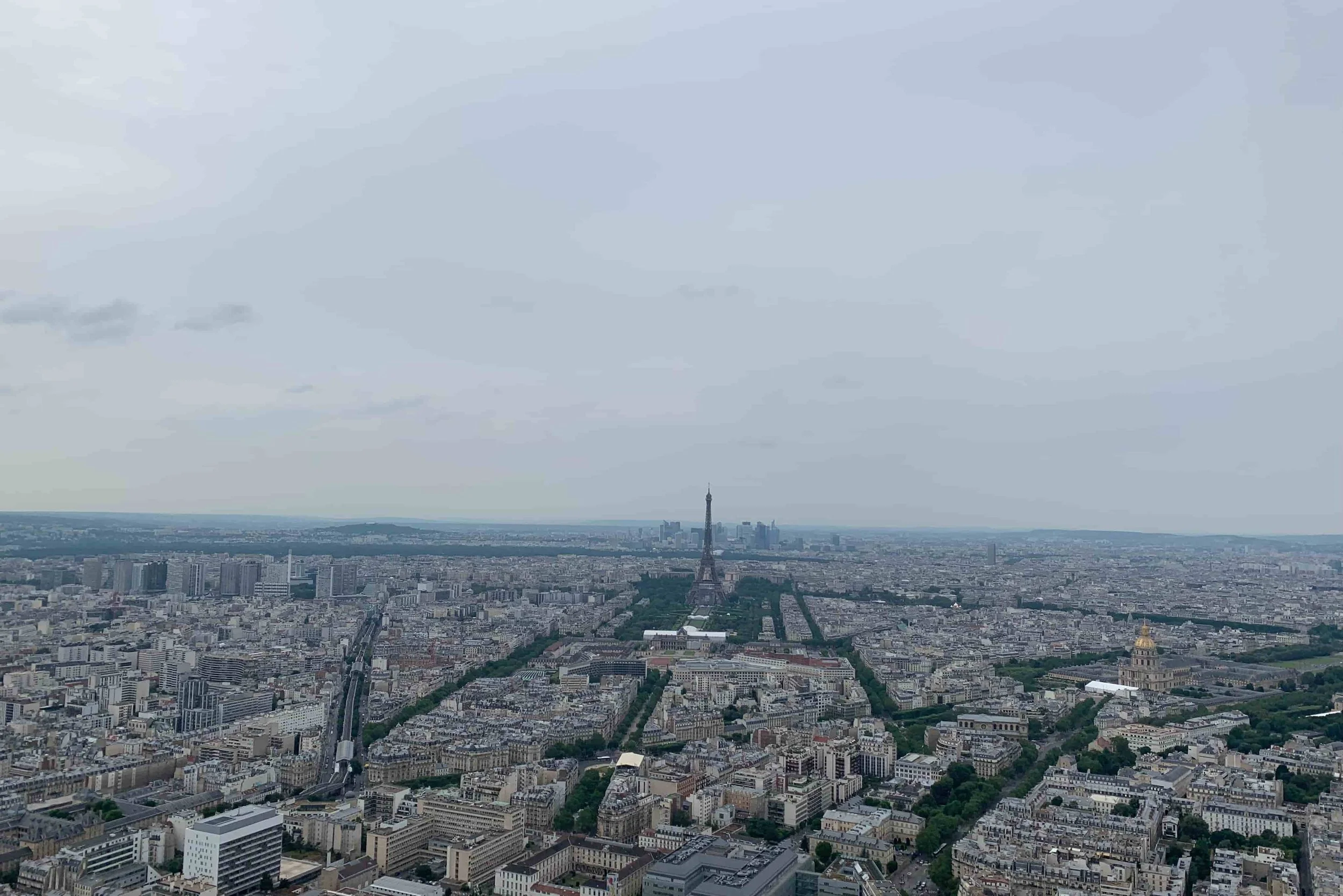 view of eiffel tower and rest of paris cloudy day