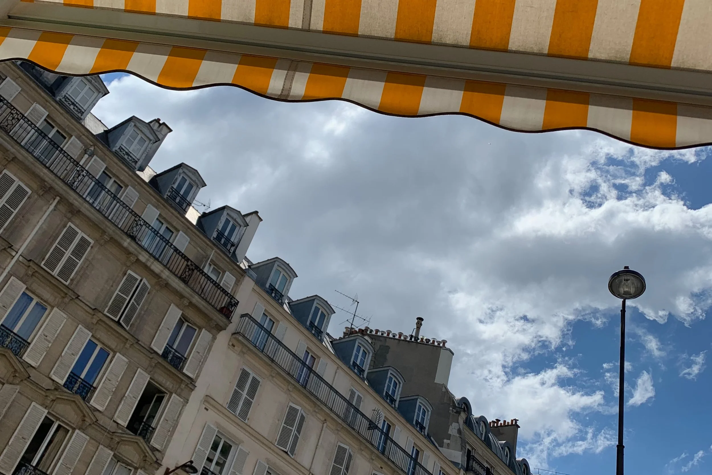 paris rooftops with orange awning