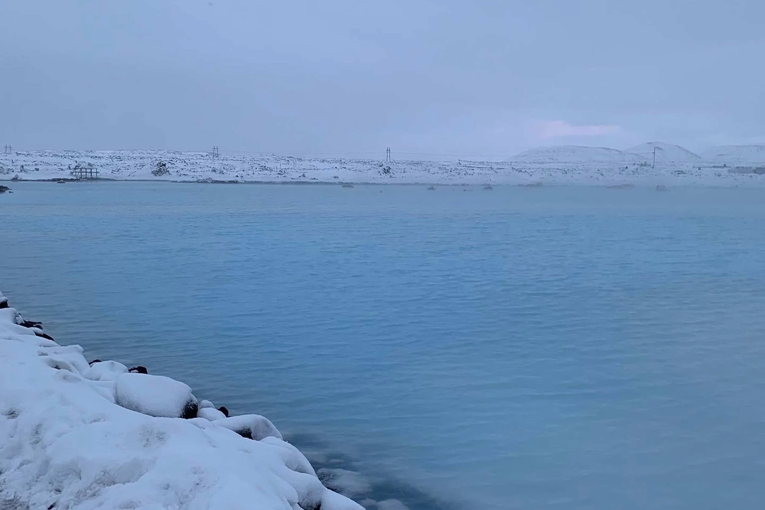 view of blue lagoon in the snow in december on christmas eve