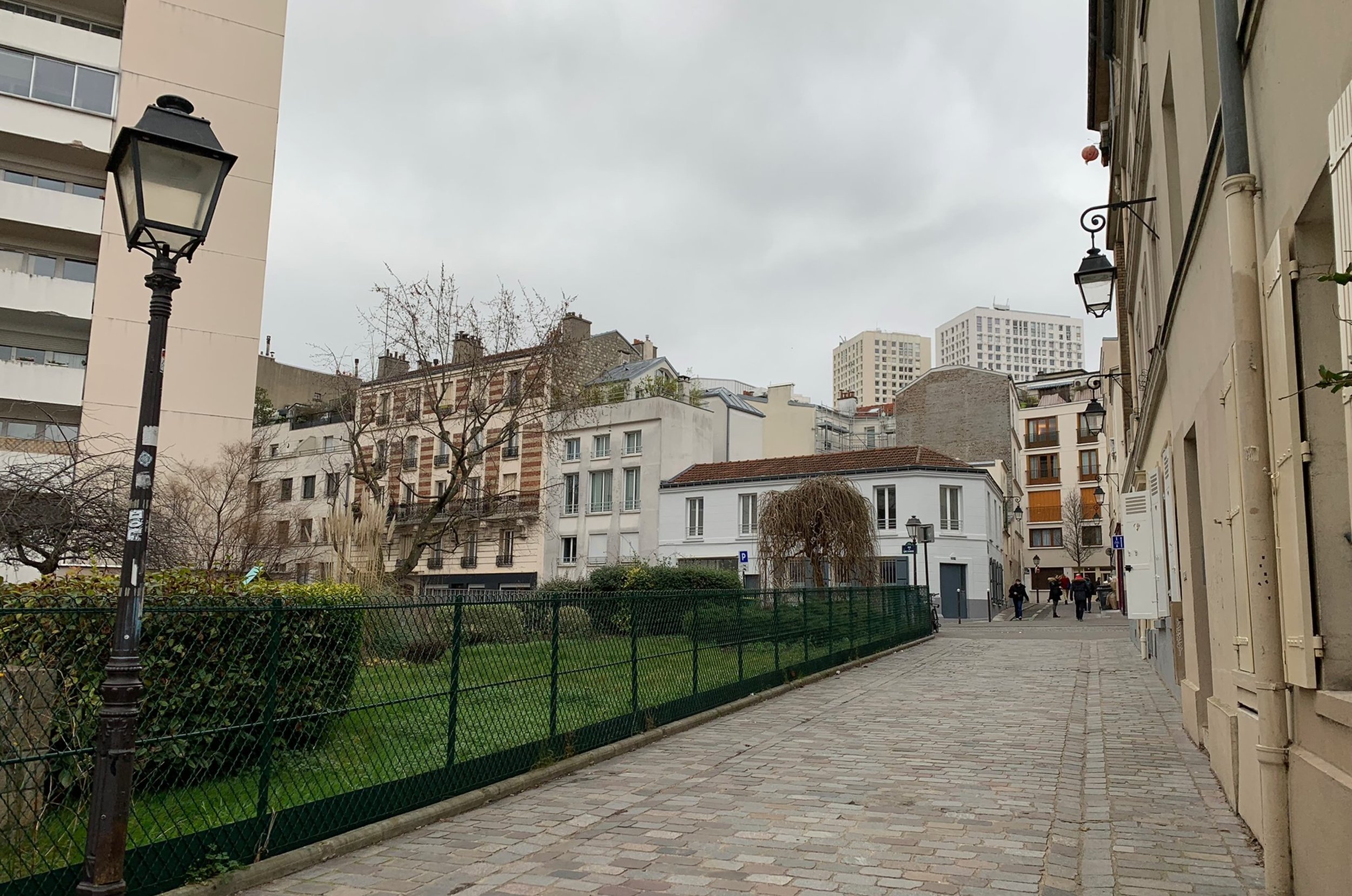 quiet residential area paris with lamp posts