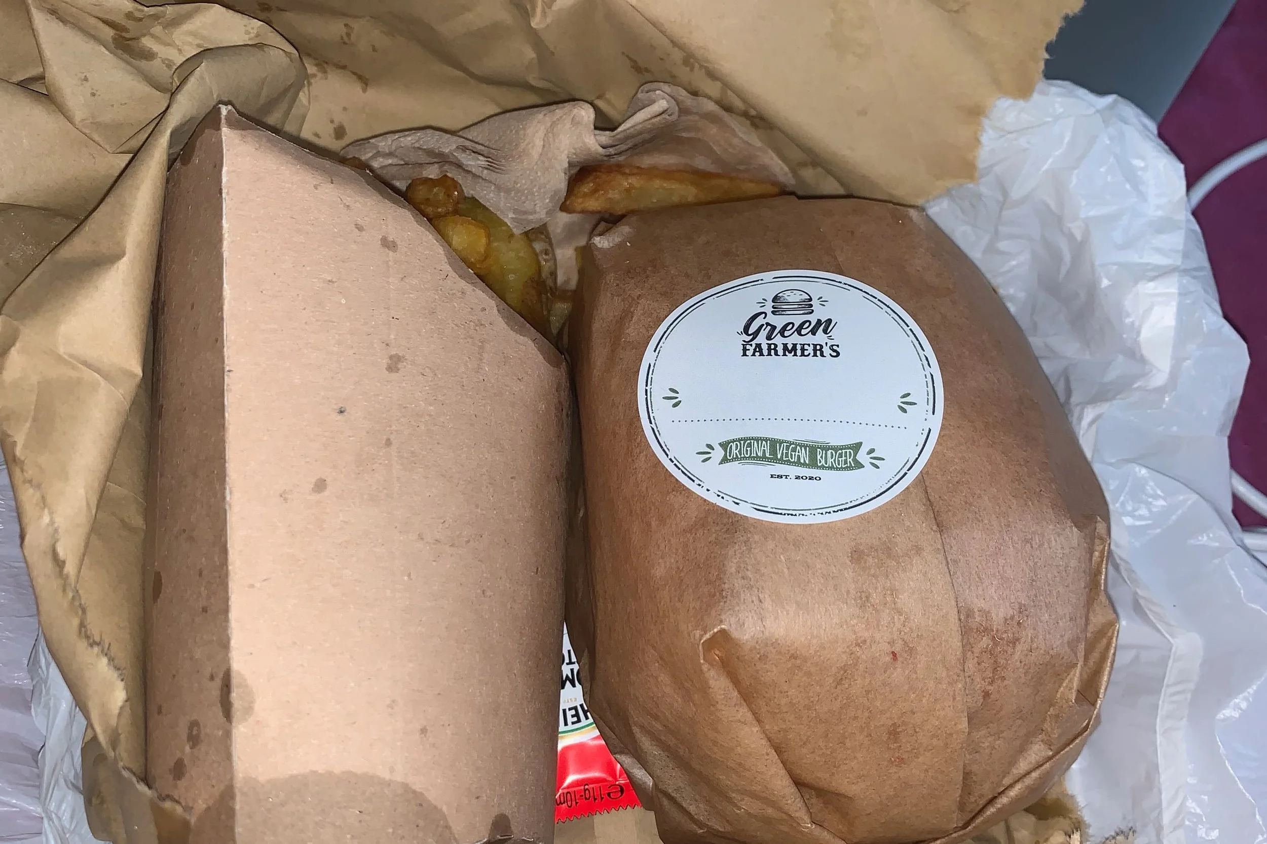 burger in paper wrapping