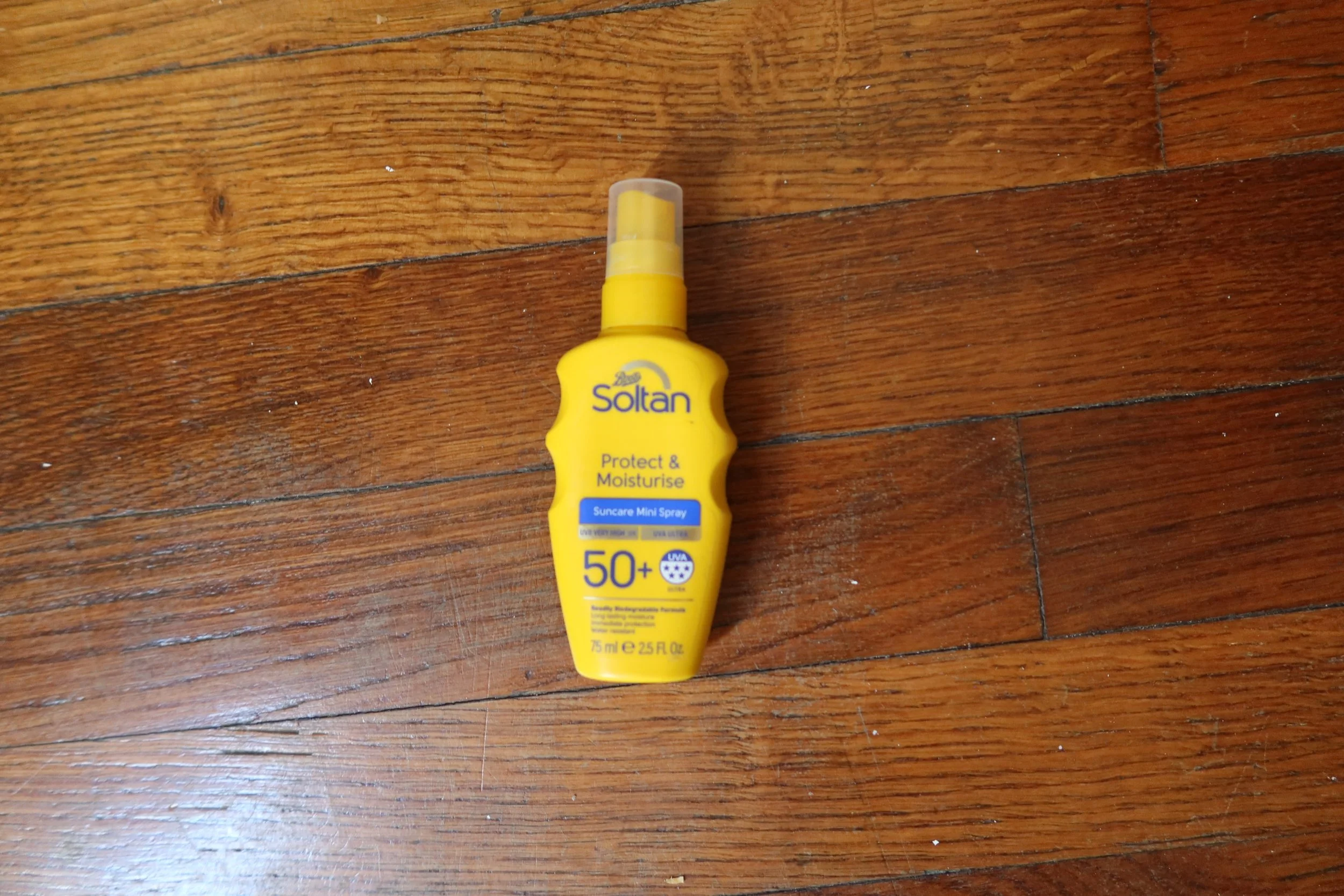 mini yellow spray sunscreen for travel