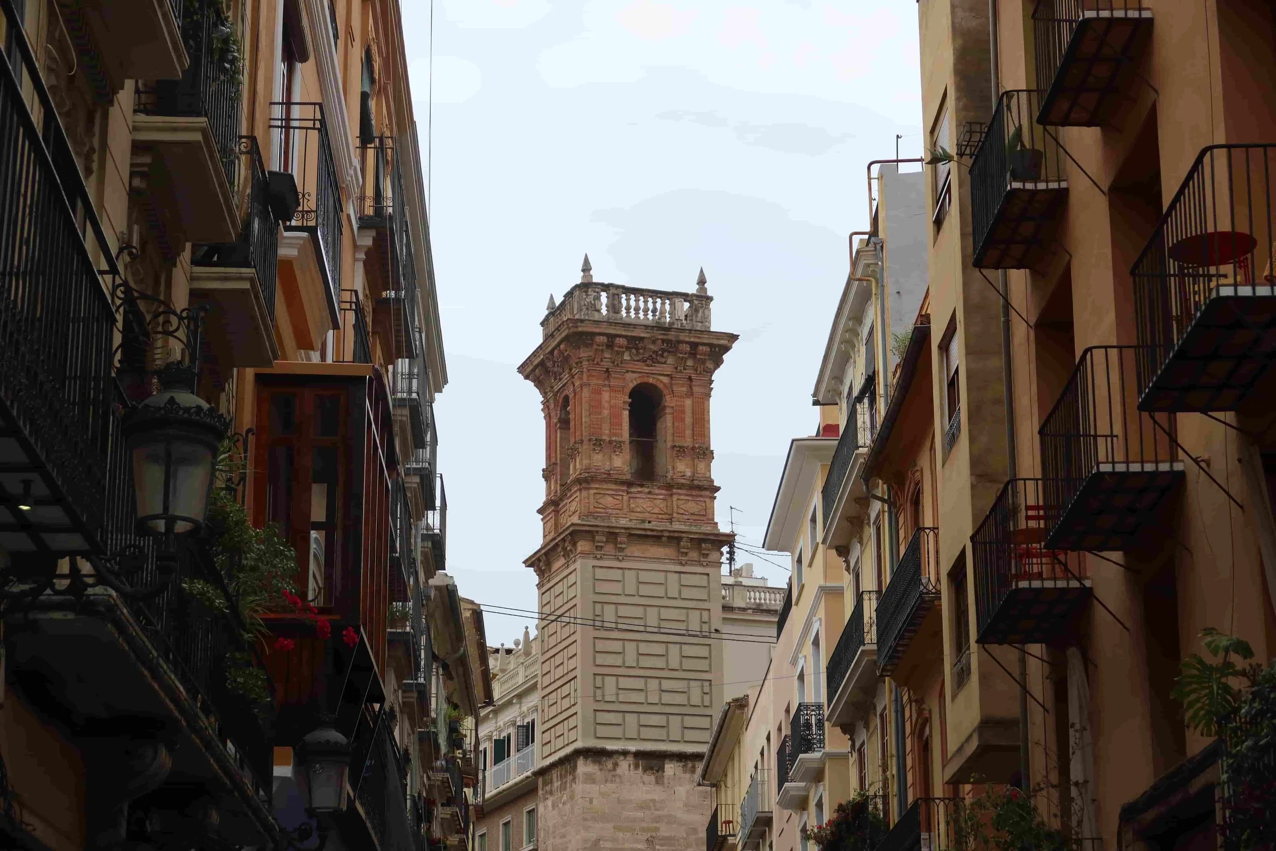 red clock tower on charming street