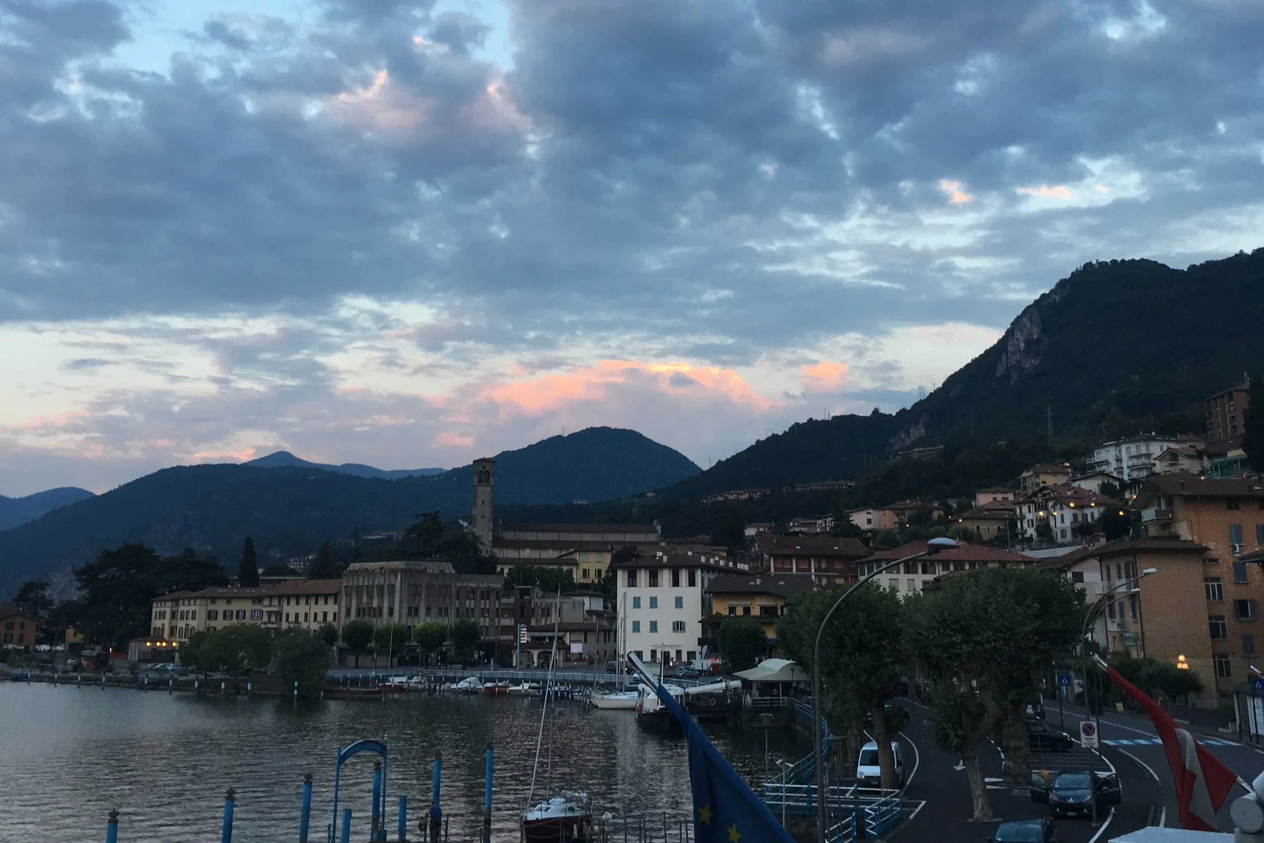 dusk and mountian view on lake with traffic below