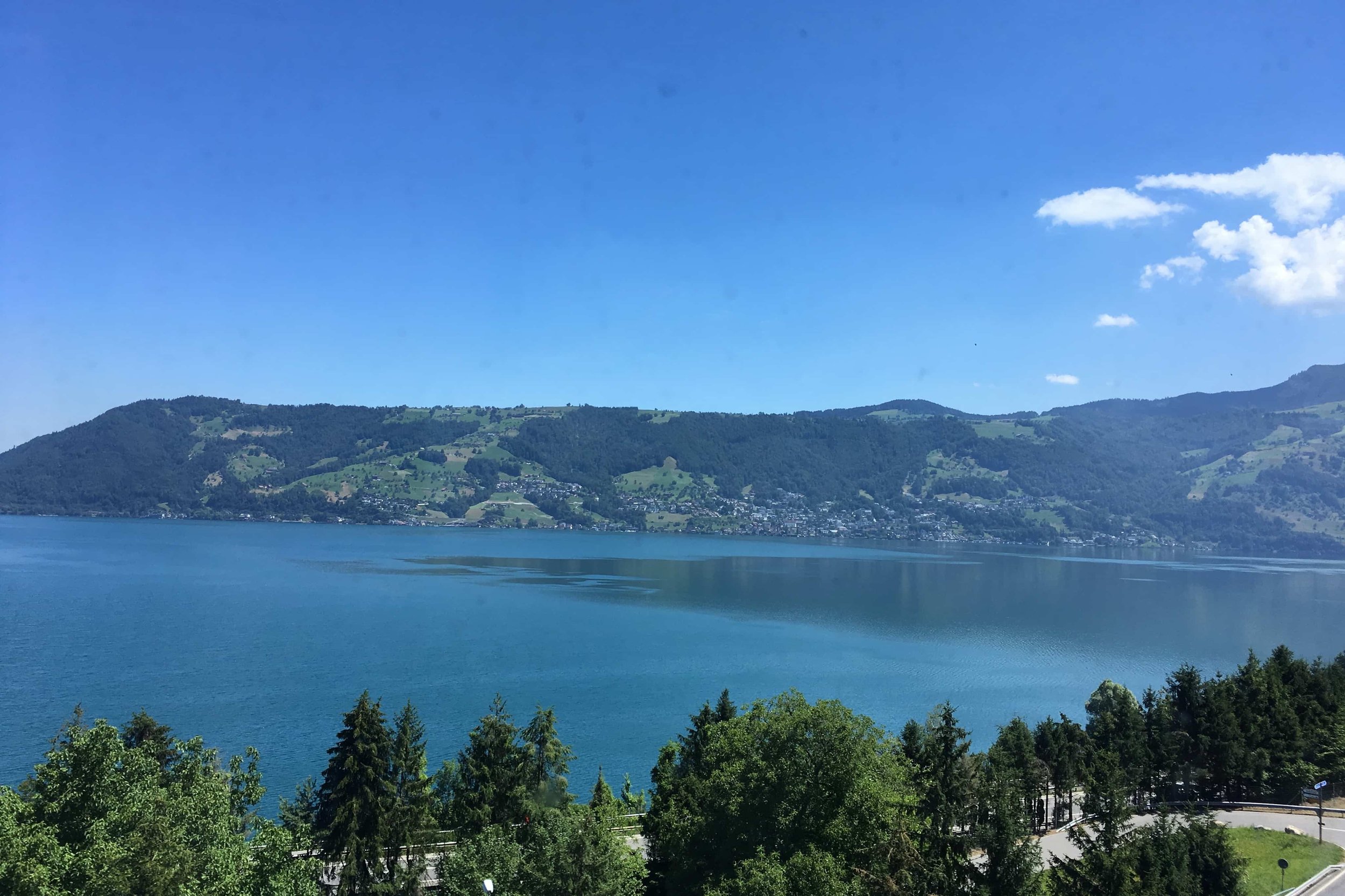 blue lake and green rolling hills