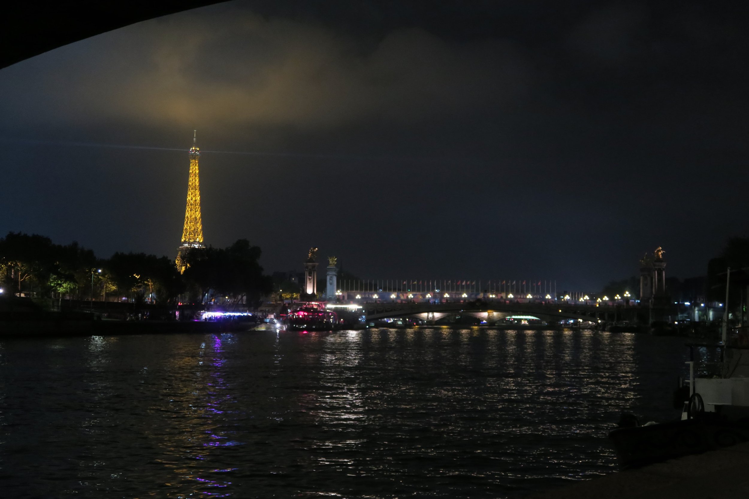 view of seine and eiffel tower at night