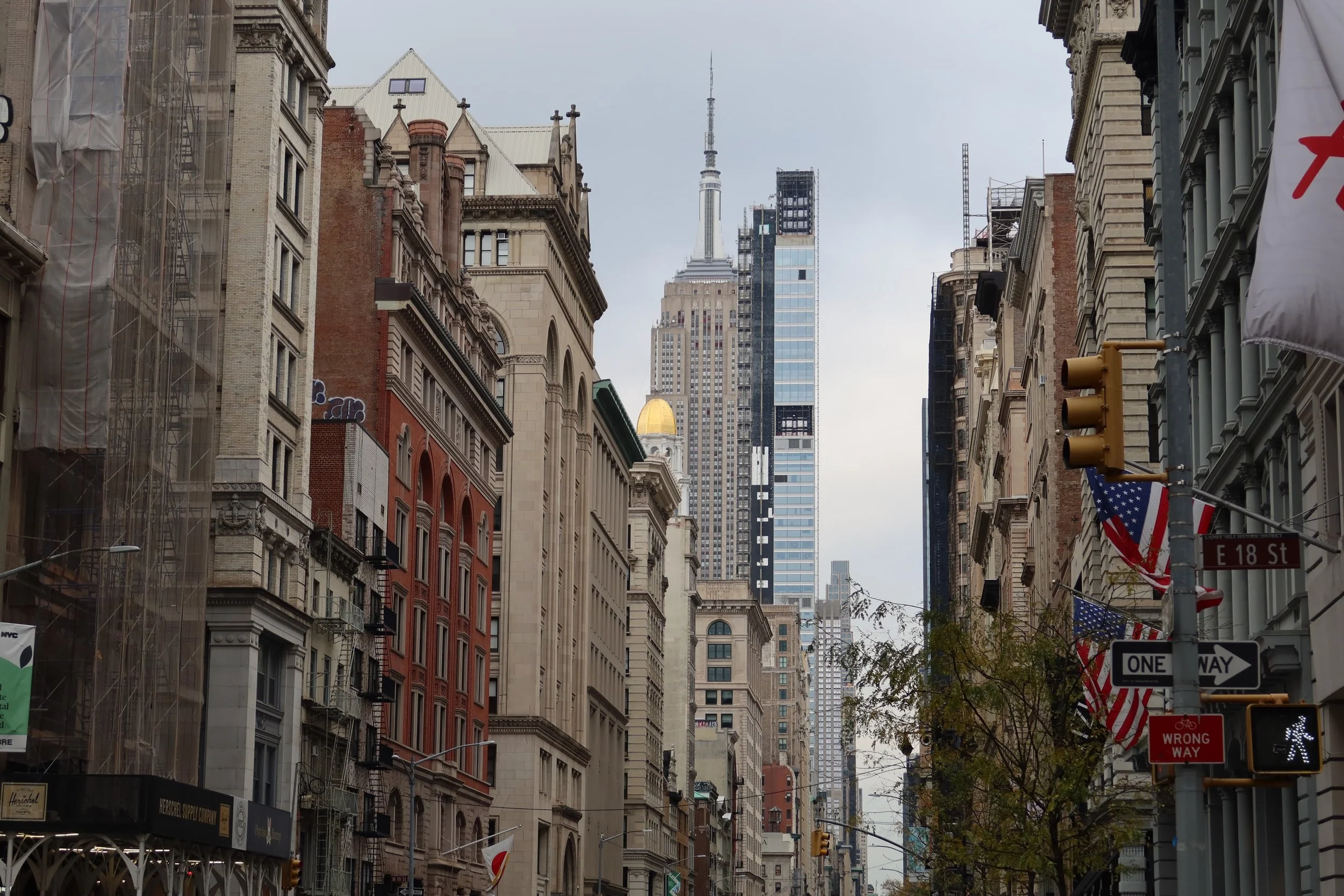 Walking on 5th avenue towards uptown in Manhattan with view of Empire State Building