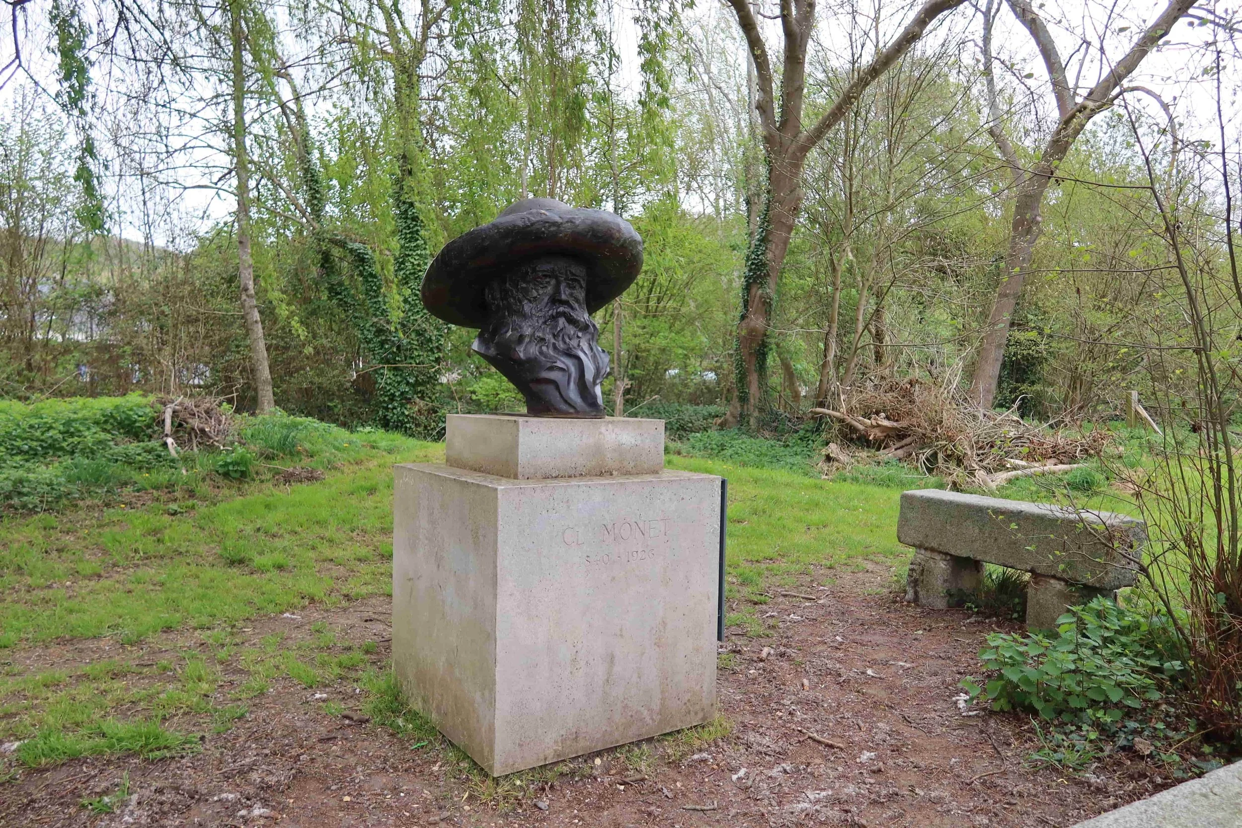 small black bust of monet in giverny