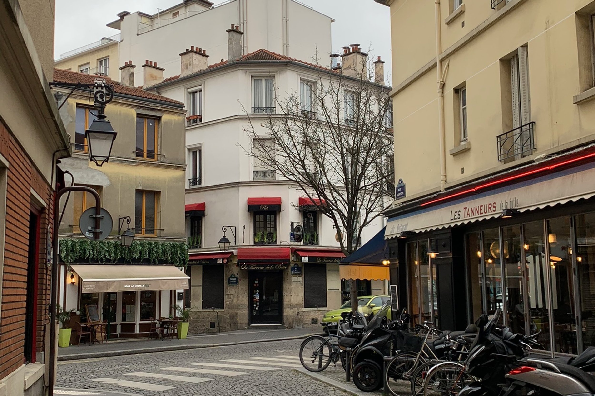 charming street with warm colors bikes and cafes yellow buildings