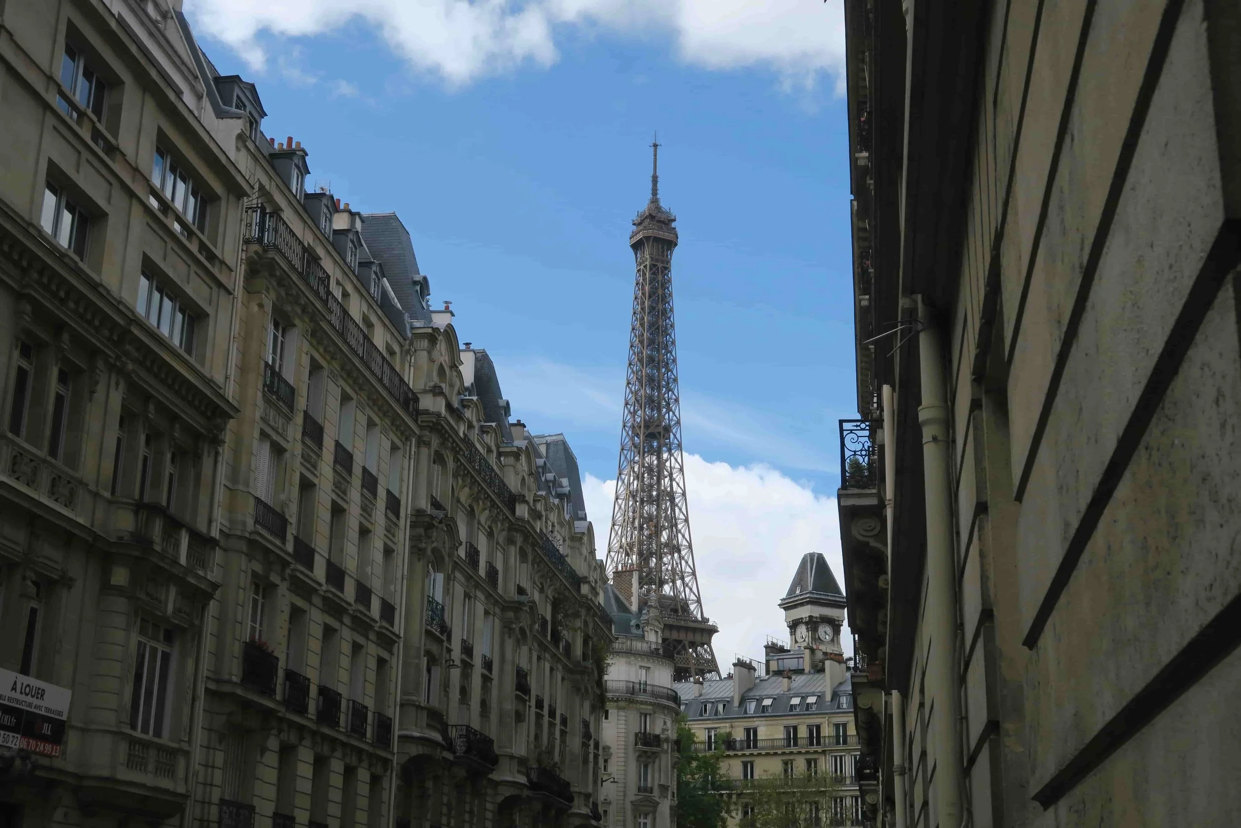 eiffel tower in the middle of the street up close