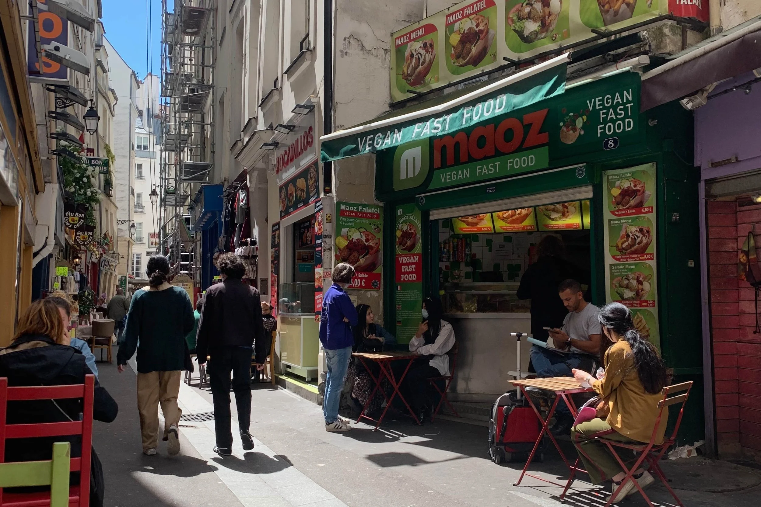 street food in busy narrow student street in paris
