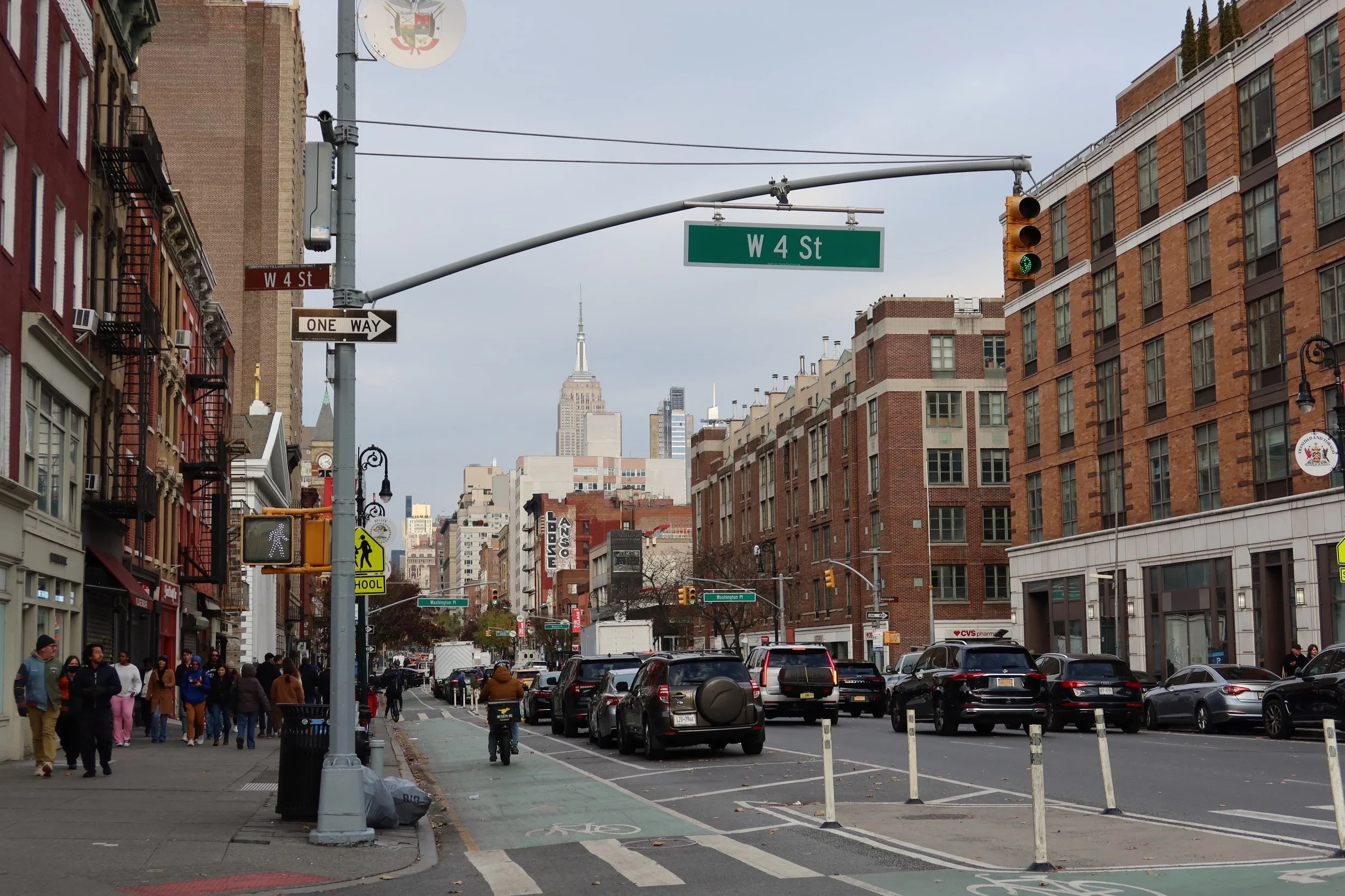 view of empire state building on busy street