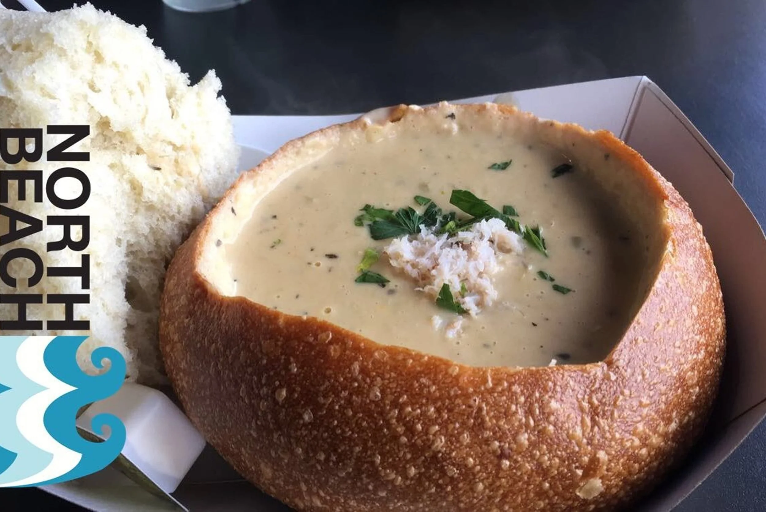 clam chowder soup in a bread bowl
