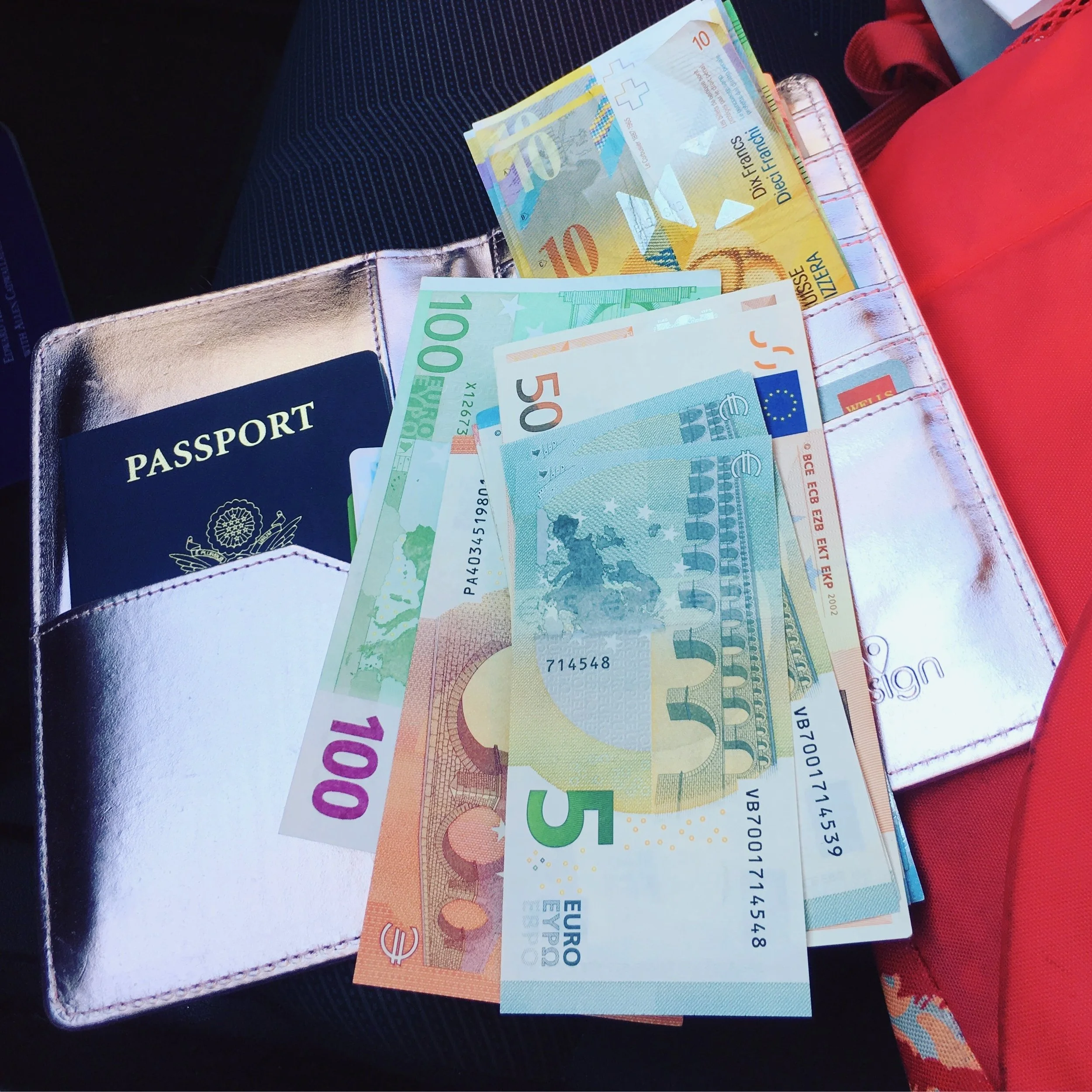 Passport holder with foreign currency
